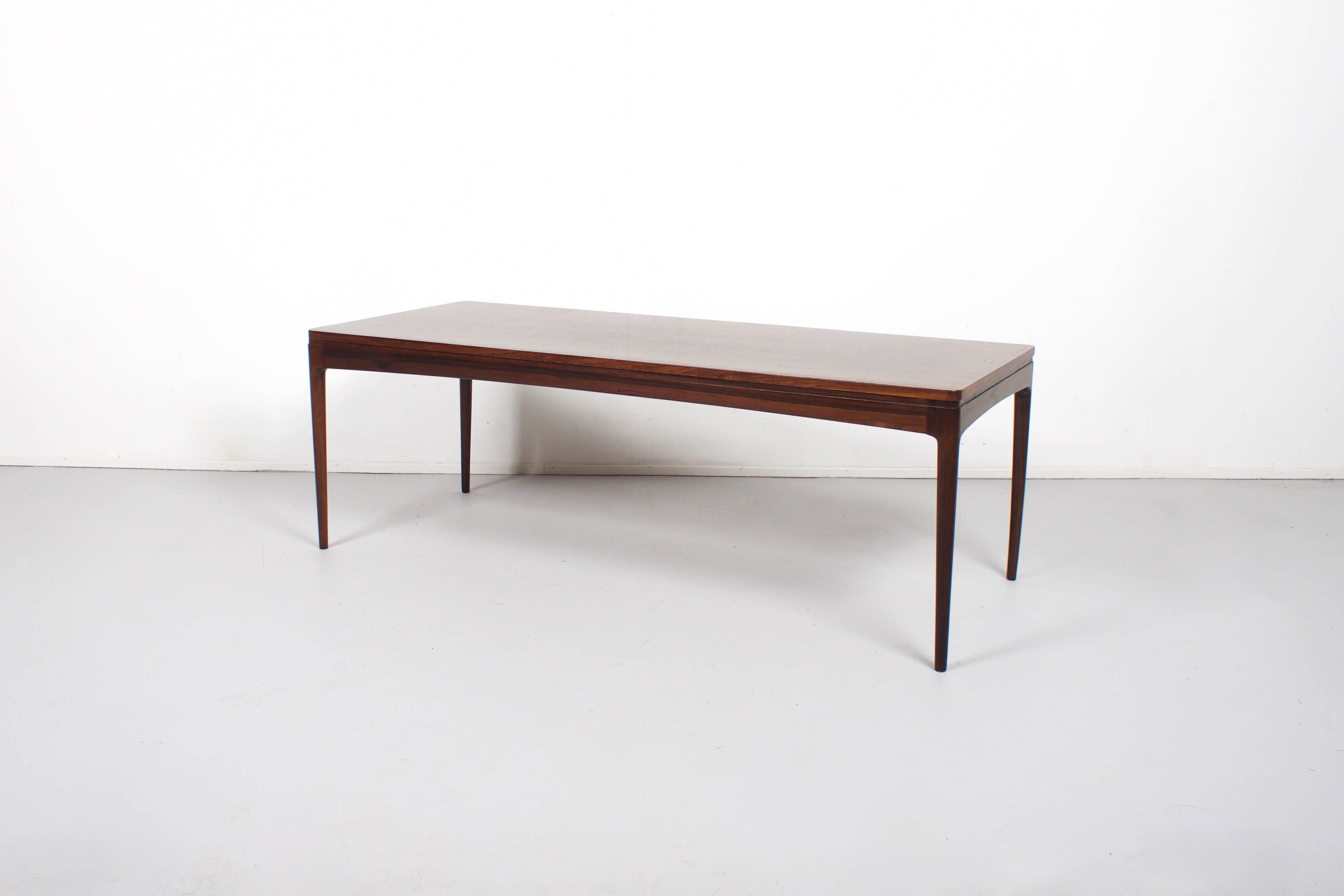 Coffee Table by Johannes Andersen in very good condition

Solid teak top and legs

The teak has a beatiful grain 

While information on designer Johannes Andersen is limited and difficult to verify, it is believed that he was born in 1903 in Aarhus,