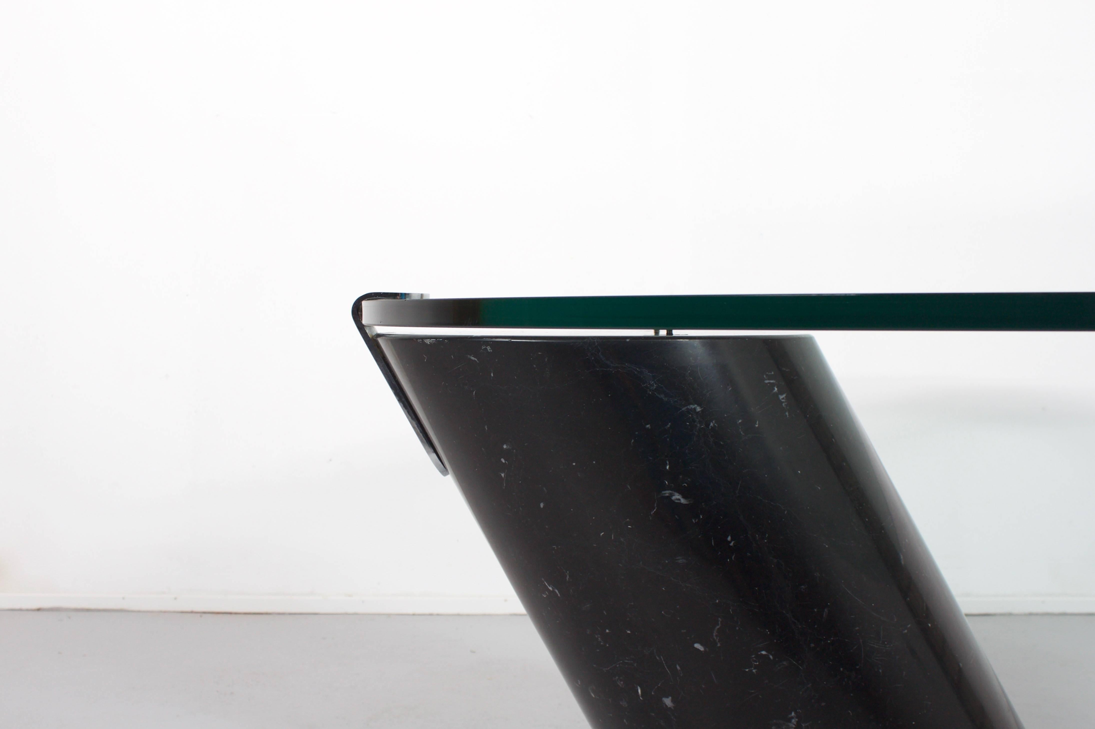 Asymmetric coffee table by Team Form AG for Ronald Schmitt, Switzerland

The base of this table is made from solid 'Nero Marquina’ marble and a thick oval glass top 

The top lays loose on the marble base only held in to place by a chromed metal lip