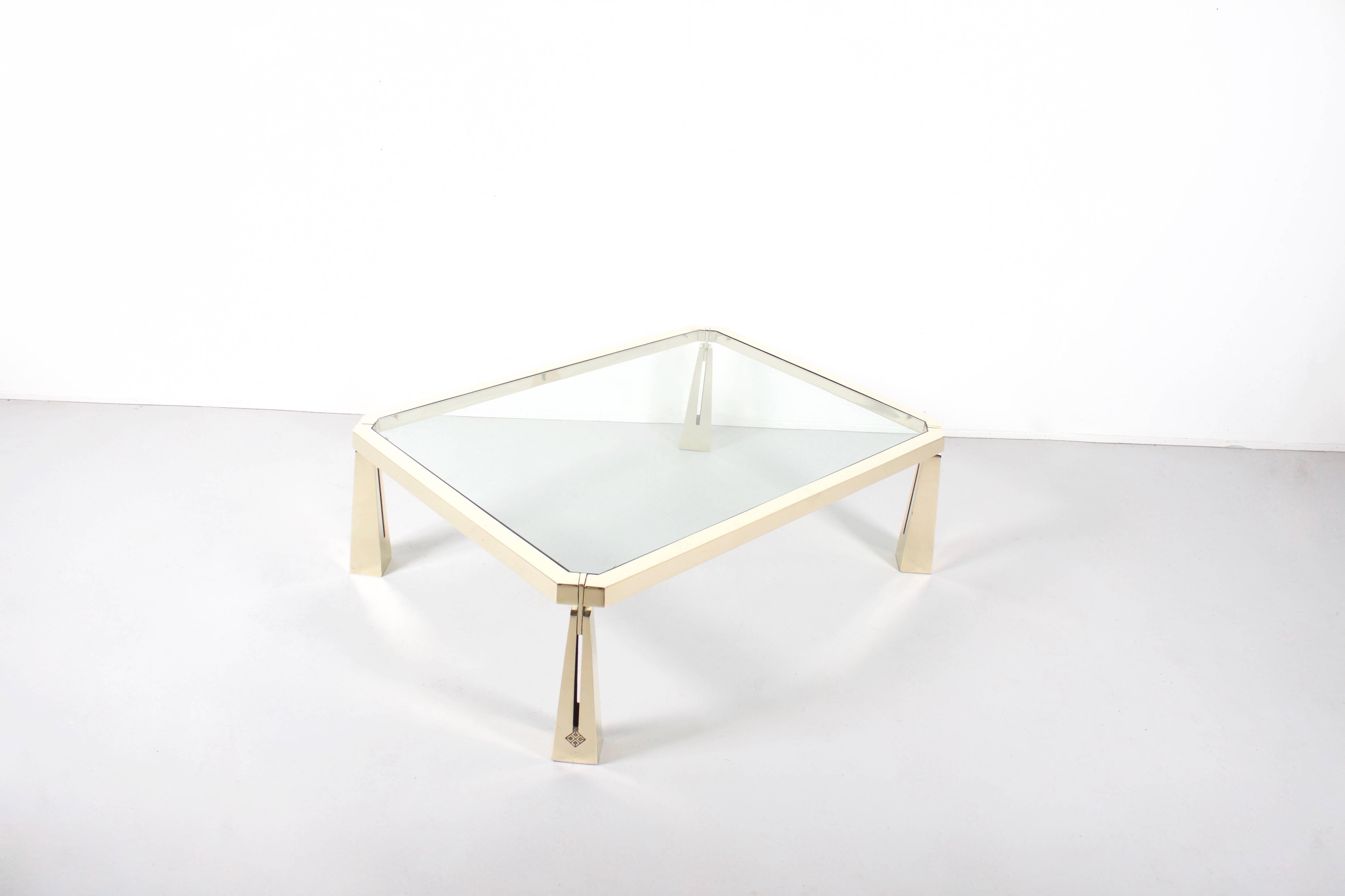 Rare Peter Ghyczy coffee table in very good condition.

Made of solid brass with a glass top.

The table has been fully polished.

This table has been produced in very limited quantities in the 1980’s 

Each leg features the Ghyczy logo.

We offer a