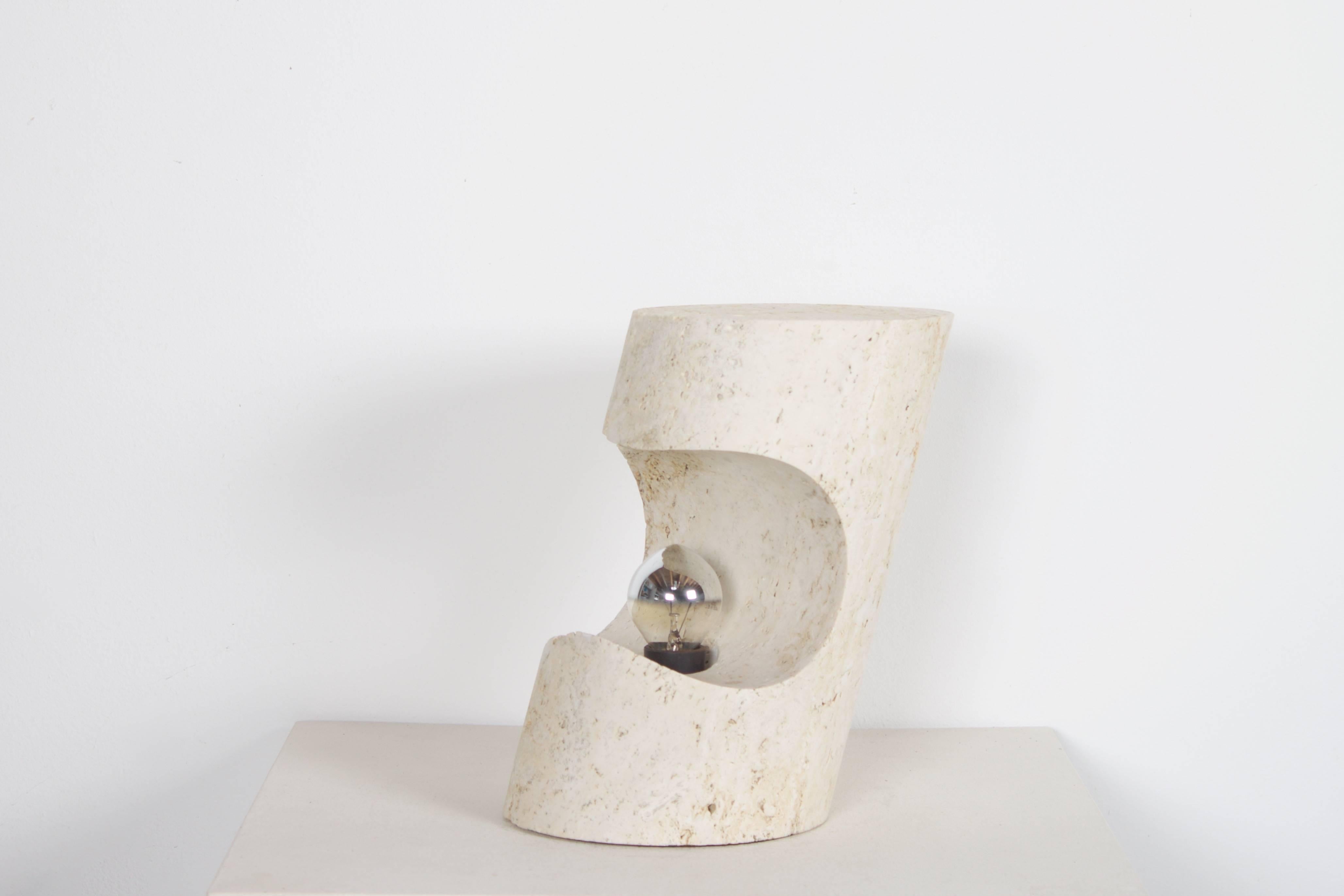 Beautiful table lamp by Giuliano Cesari for Nucleo, a division of the Sormani lamp company Milan, Italy.

Designed in 1971.

Made out of one piece of unfilled travertine.

Travertine has a characteristically aged look, Pits and holes, which speak to