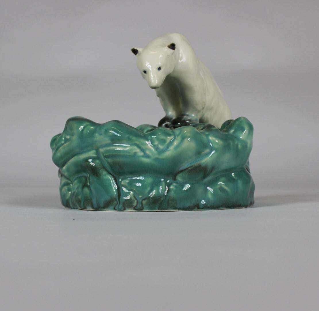 Polar bear at ice pool, a ceramic bowl manufactured by Ditmar Urbach in Czechoslovakia in the 1930s. The bowl was designed to celebrate Nora, the first polar bear in the Prague Zoo. The piece is marked ,Ditmar Urbach Made in Czechoslovakia´, it is