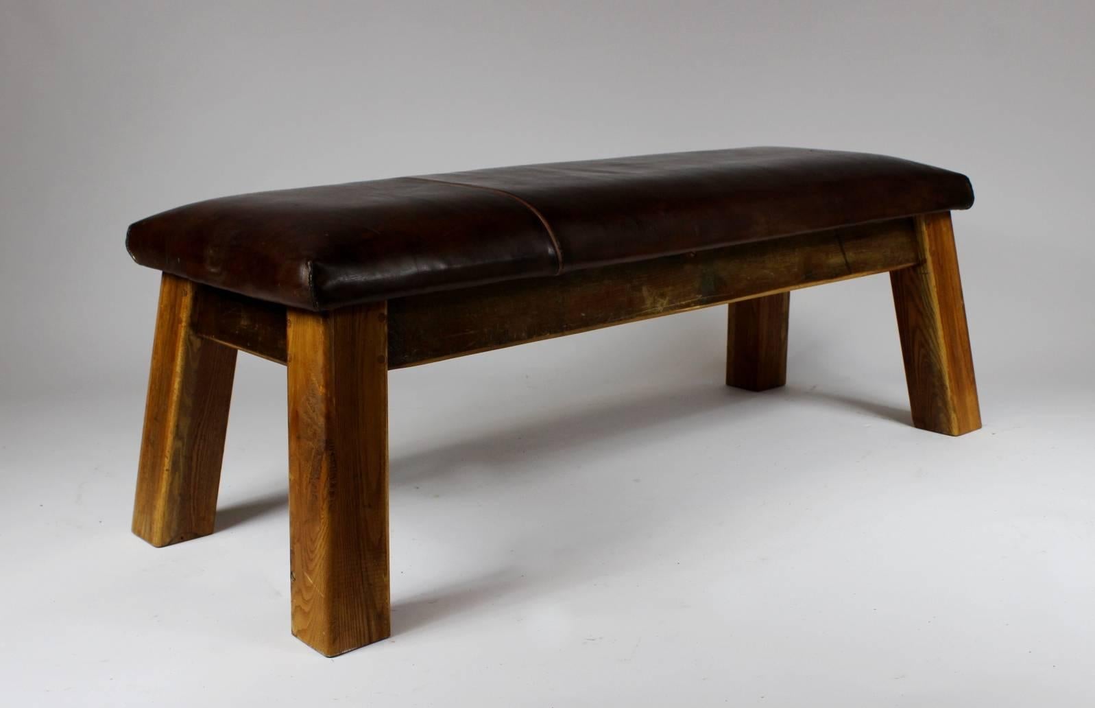 Leather gym bench from the 1930s. It is in its original condition with great patina.