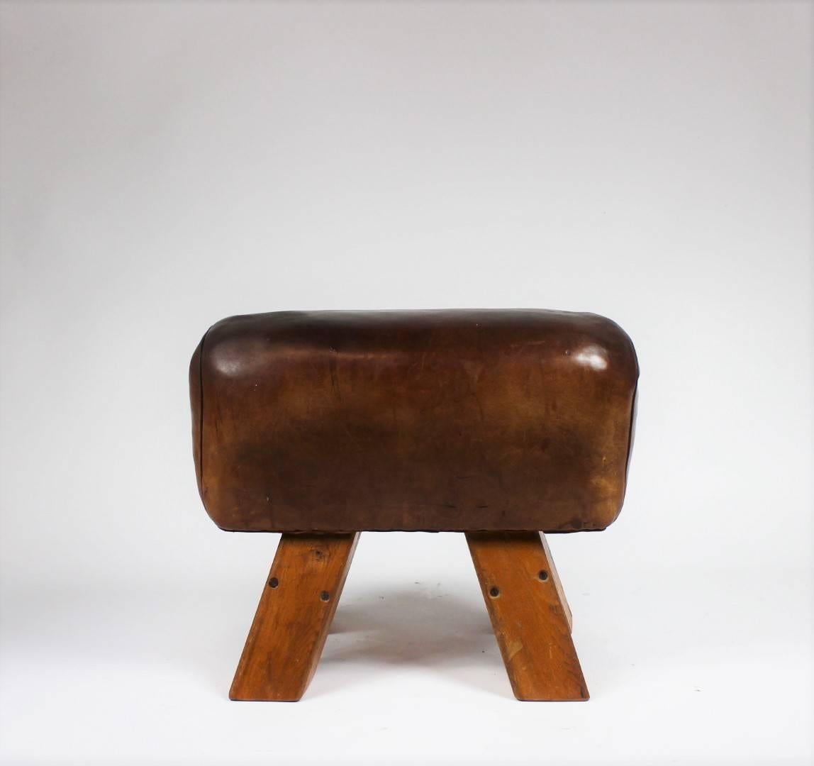 Leather gym seat from the 1950s. It is in its original condition, nice patina.