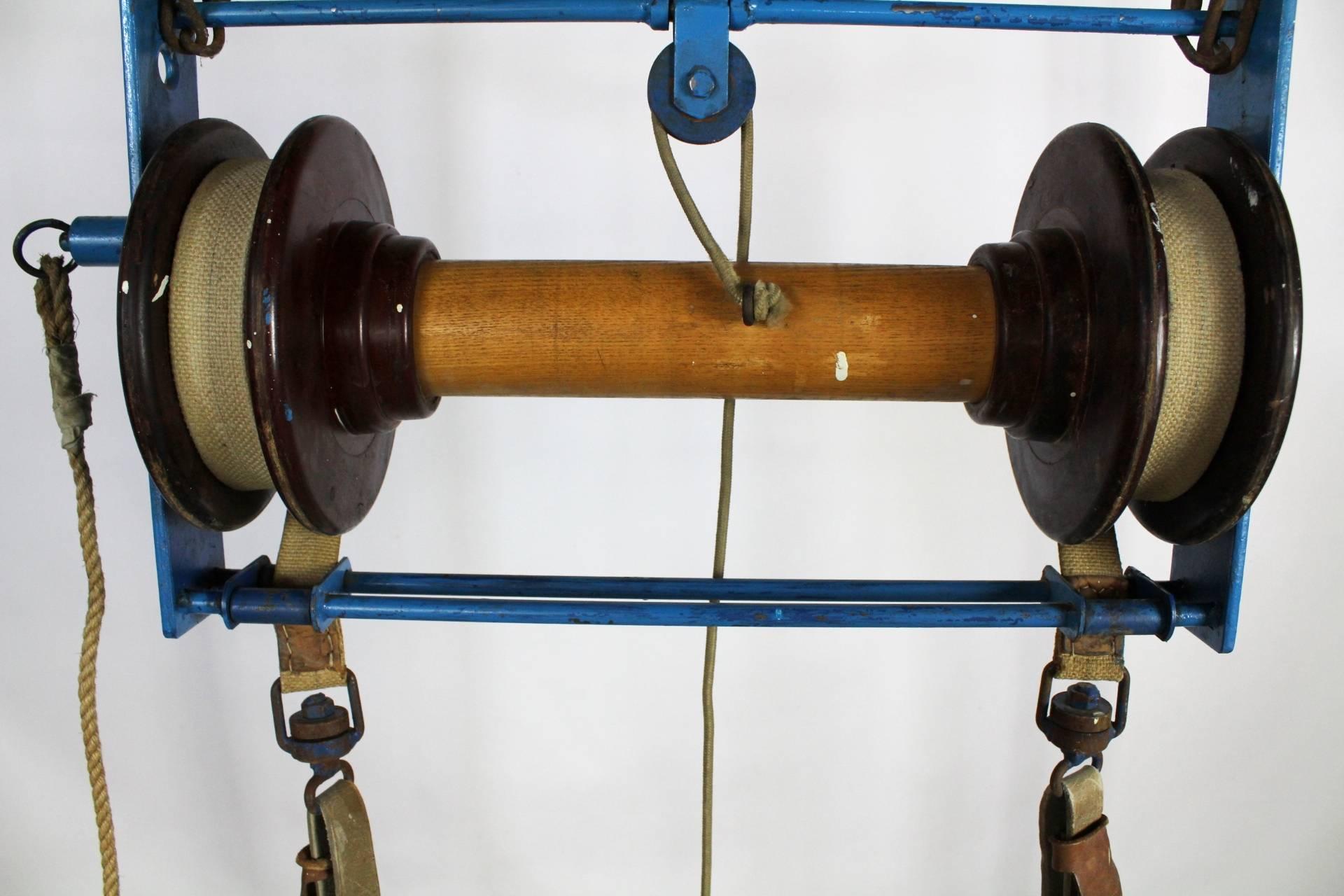 Professional gym rings with a frame made in the 1960s. The frame is made from painted steel, the rings are constructed from mahogany wood and the mechanism from oak wood. Solid cotton ropes are several meters long. More pieces available.