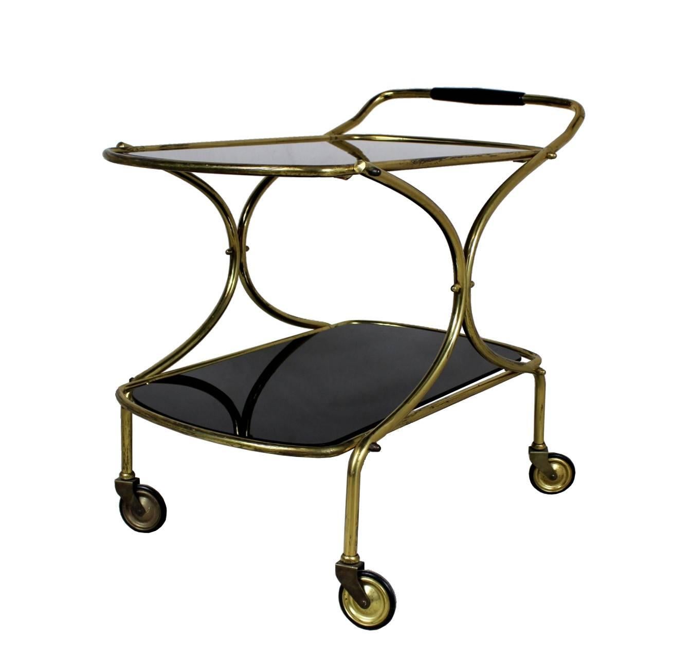 Trolley made in the 1960s in Italy. Material is brass with metallurgical glass.
