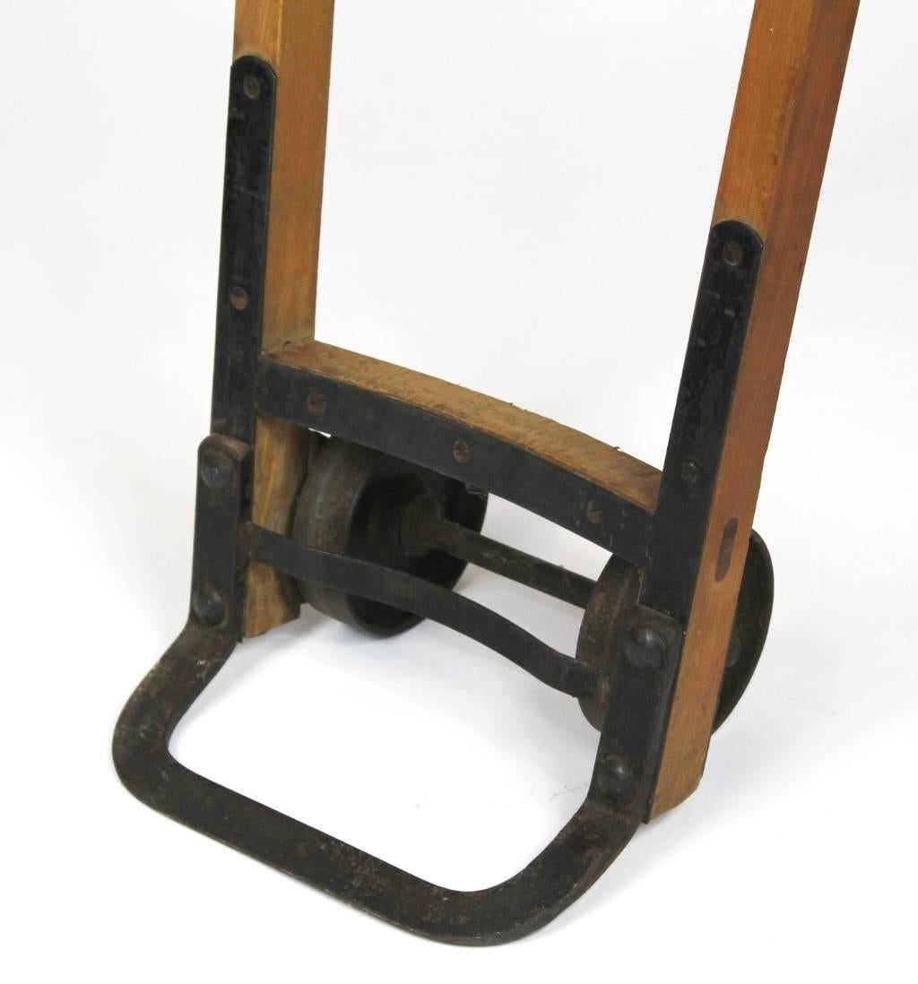 Beech and metal hand trolley manufactured by Neptun Komarov, Czechoslovakia in the 1920s. It is in its original condition with patina.