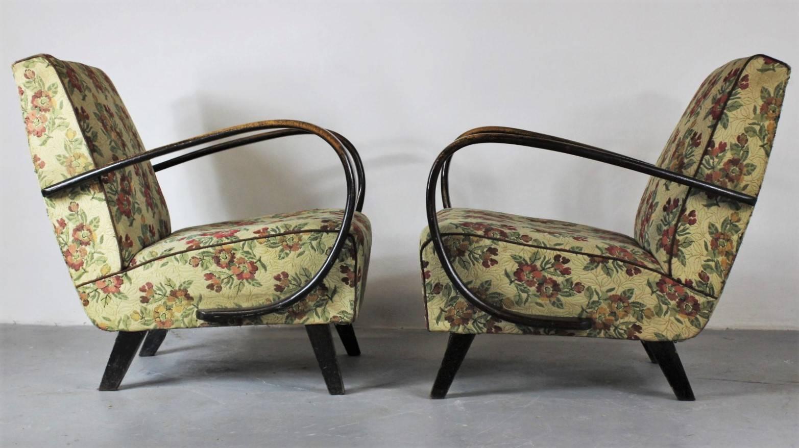 Pair of armchairs in original condition, very good and stabile construction, distressed upholstery, worn lacquer. The armchairs have been originally placed in a bakery meeting room in Prague. Two pairs available, price for one pair.