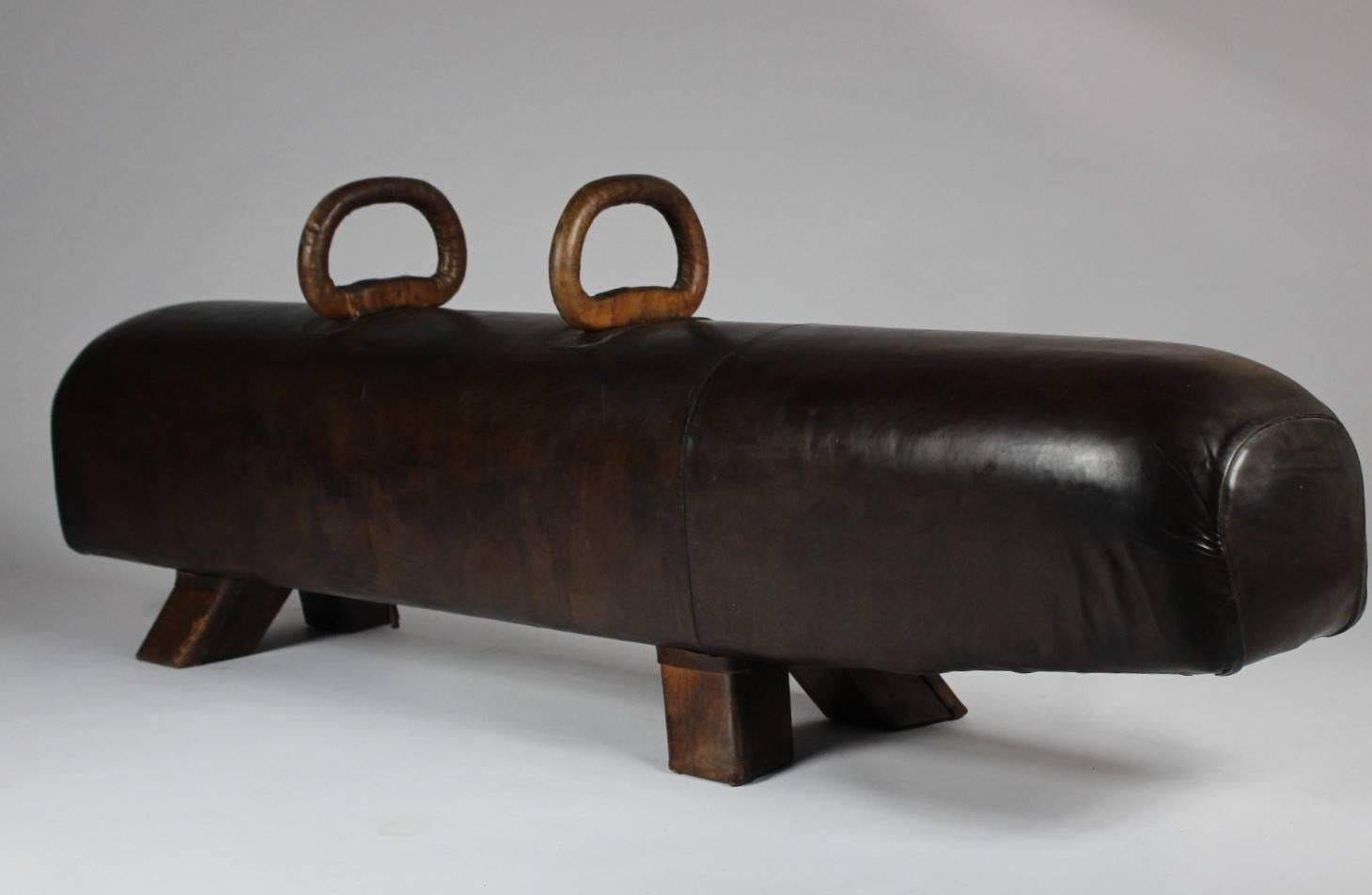 Leather gym pommel horse from the 1920s with handles. Very good original condition with great patina.