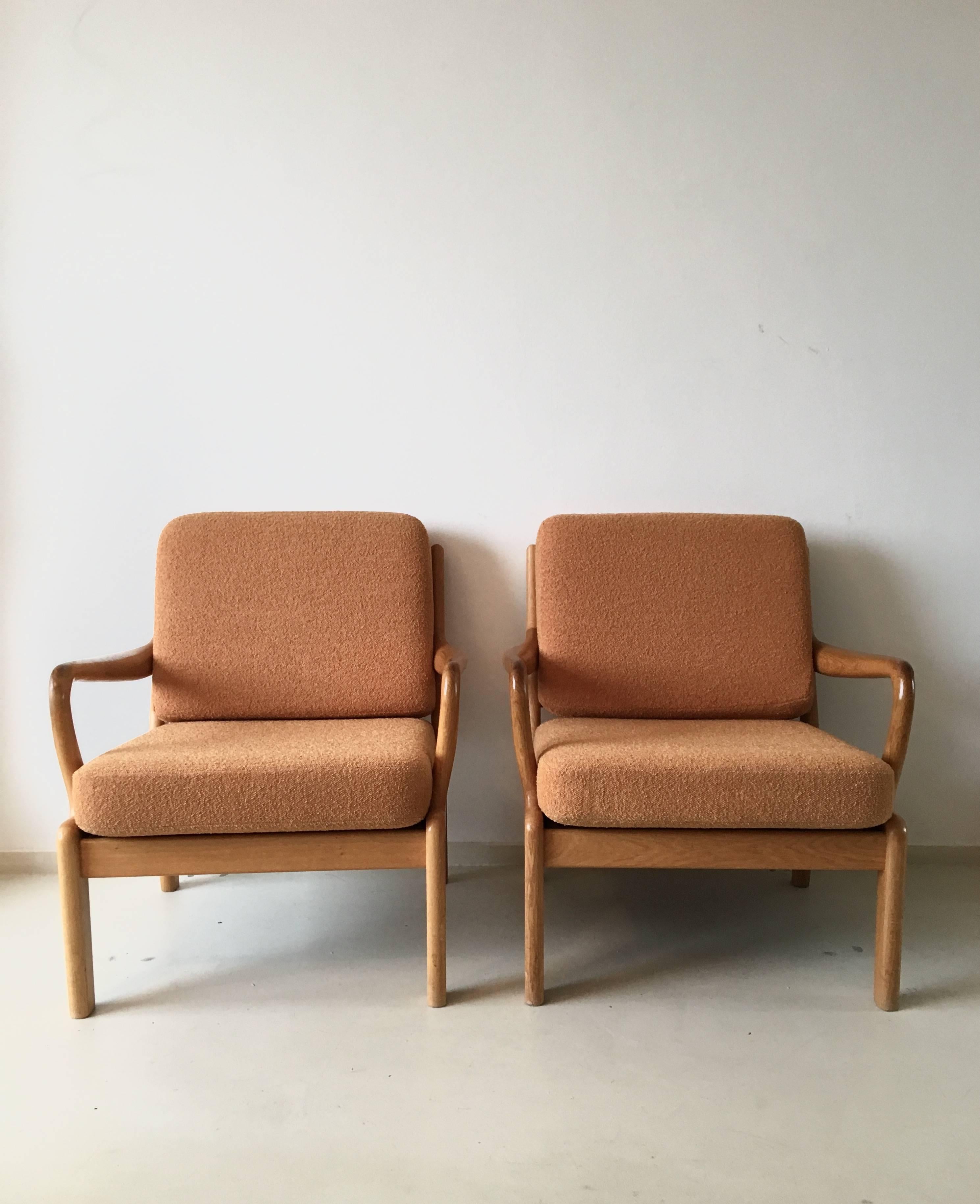 This set of Danish chairs come with frames constructed out of solid teakwood, with sculpted armrests and orange textured fabric which is in a very good condition. Classic and timeless high quality design.

Marked, made in Denmark, member of the