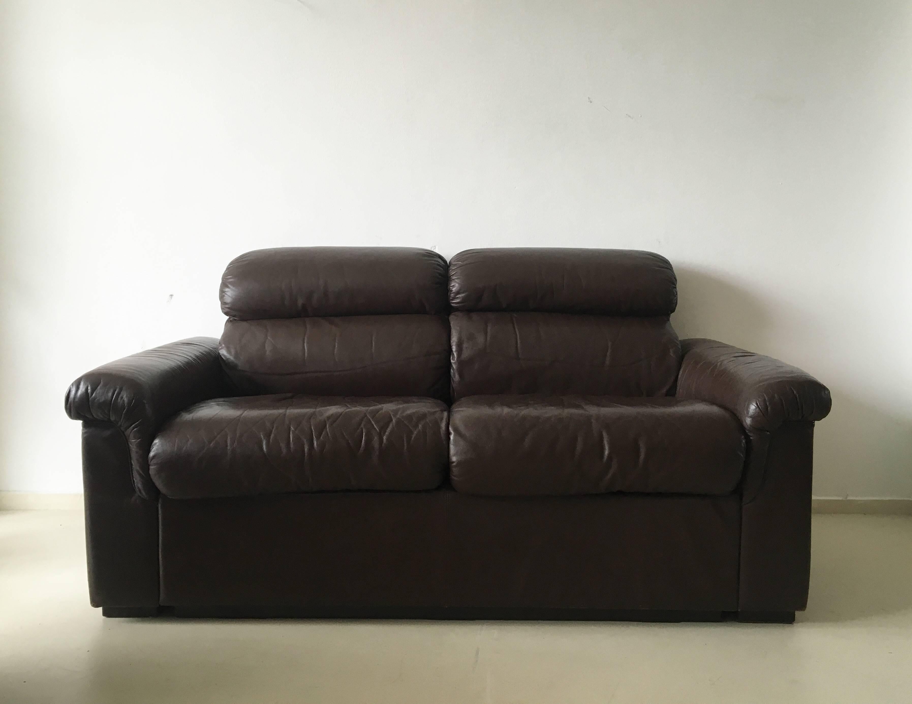 This couch was designed by OY BJ Dahlqvist and manufactured by BD furniture in Finland, circa the 1960s. It was made from soft brown leather and has a frame made out of wood. This two seat couch is in a very good condition with small signs of age