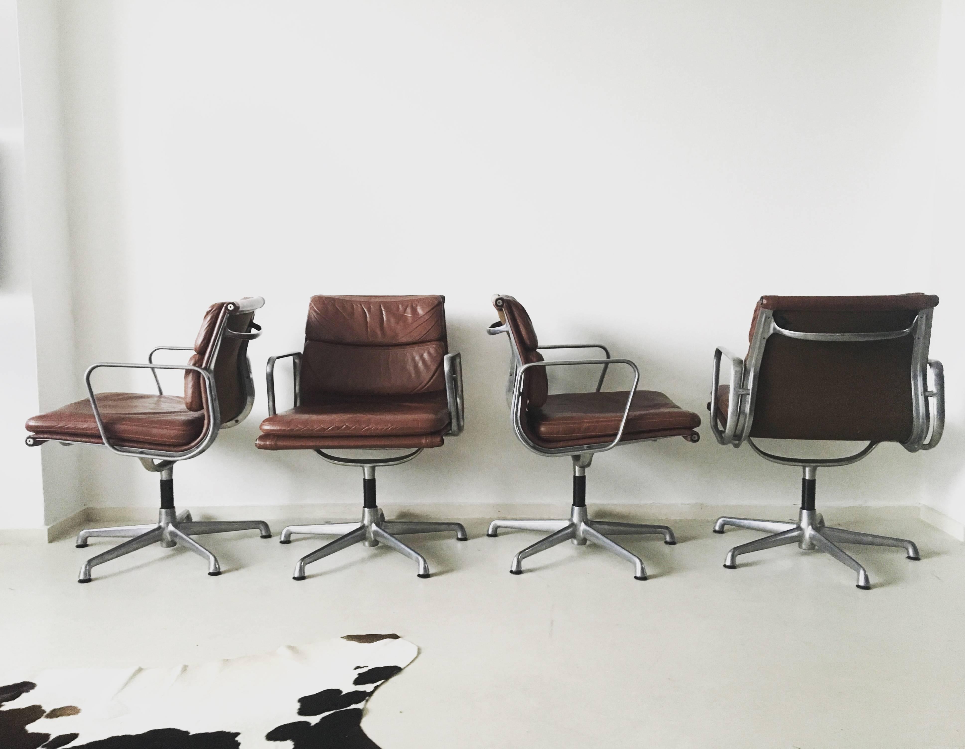 These swivel chairs were designed by Charles Eames in the 1960s and produced by ICF, Italy under the licence of Herman Miller.

They come with a polished Aluminium base and rare 5 star feet. It's very comfortable seating is in cognac colored