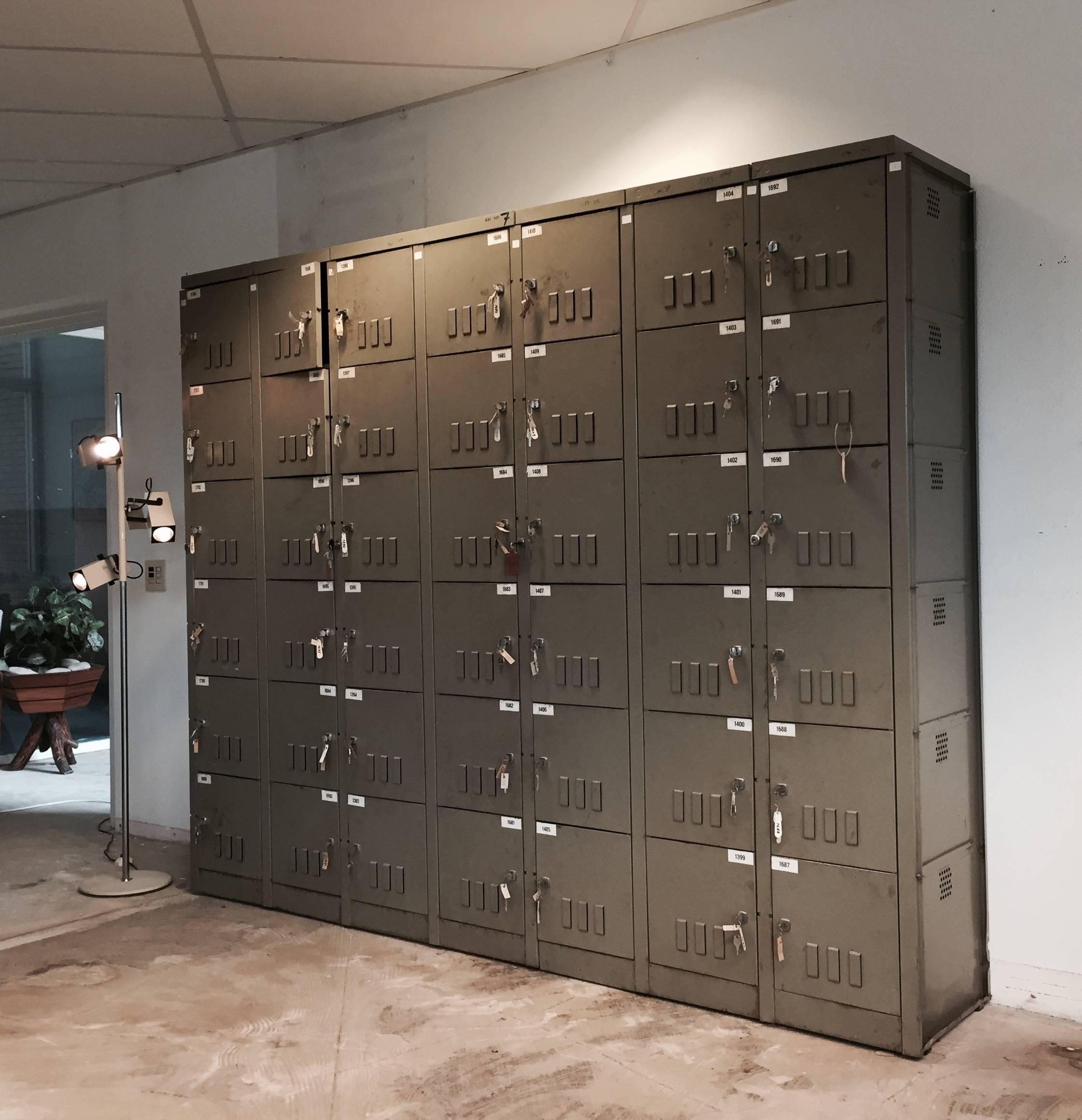 This large industrial cabinet was manufactured by Mewaf in Belgium in the 1950s. It is believed that the cabinet was used in a Belgian coal mine. The cabinet features 42 lockers which all come with the original key.

The position of the lockers can
