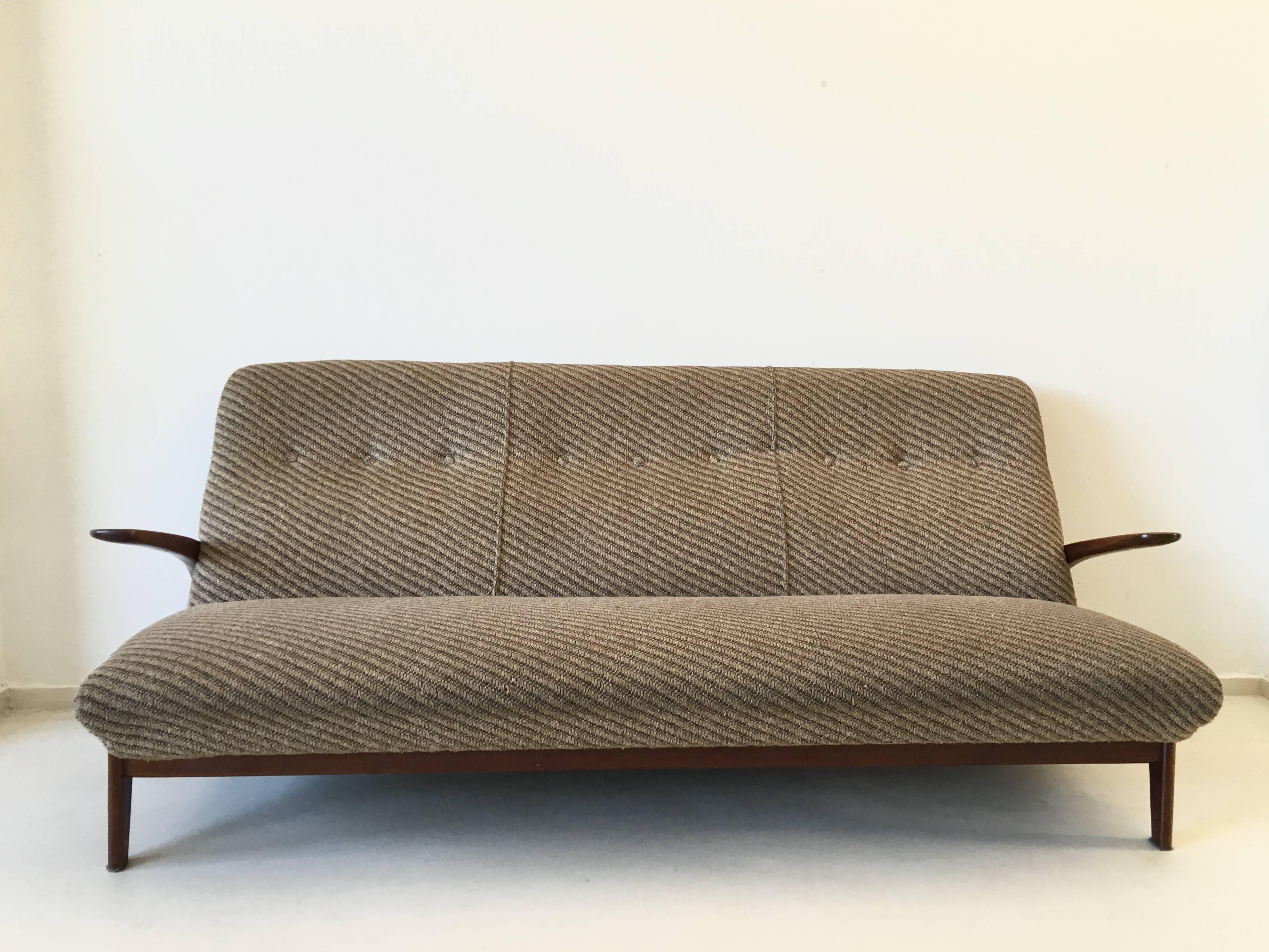 This beautiful three-seat sofa consists of an organic shaped frame in teak and the original fabric. It remains in good condition with normal wear, consistent with age and use. Eccentric model!

 