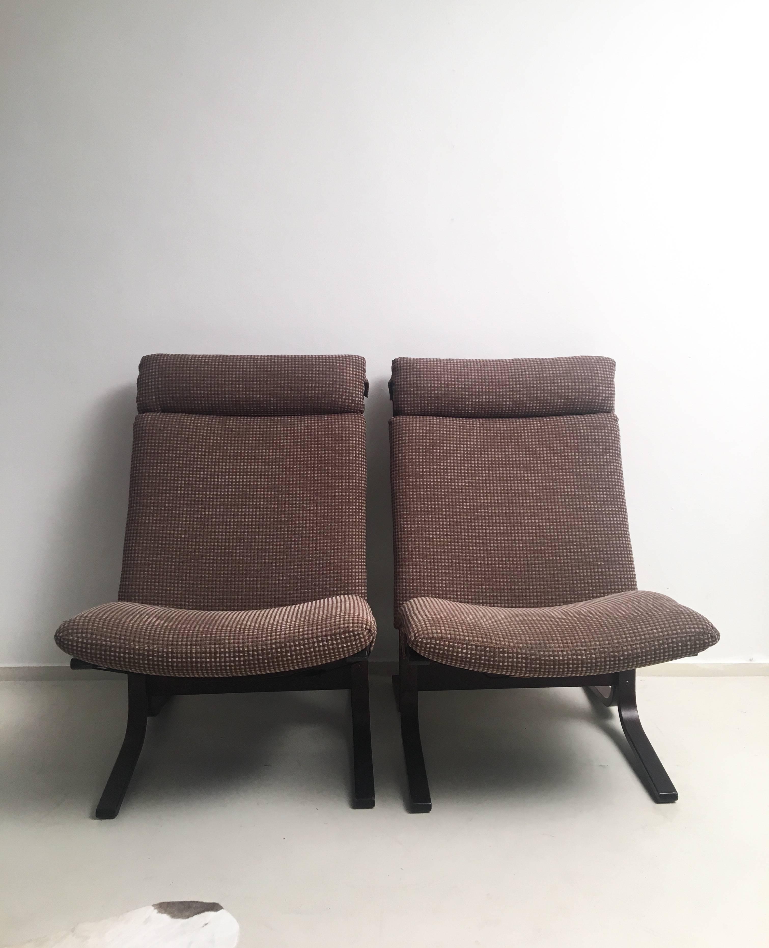 This set of sling chairs were designed by Ingmar Relling, circa the 1960s in Norway. They feature a dark bentwood frame, thick and very comfortable cushions with a mixed brown colored fabric. One of the chairs is labeled with the manufacturers