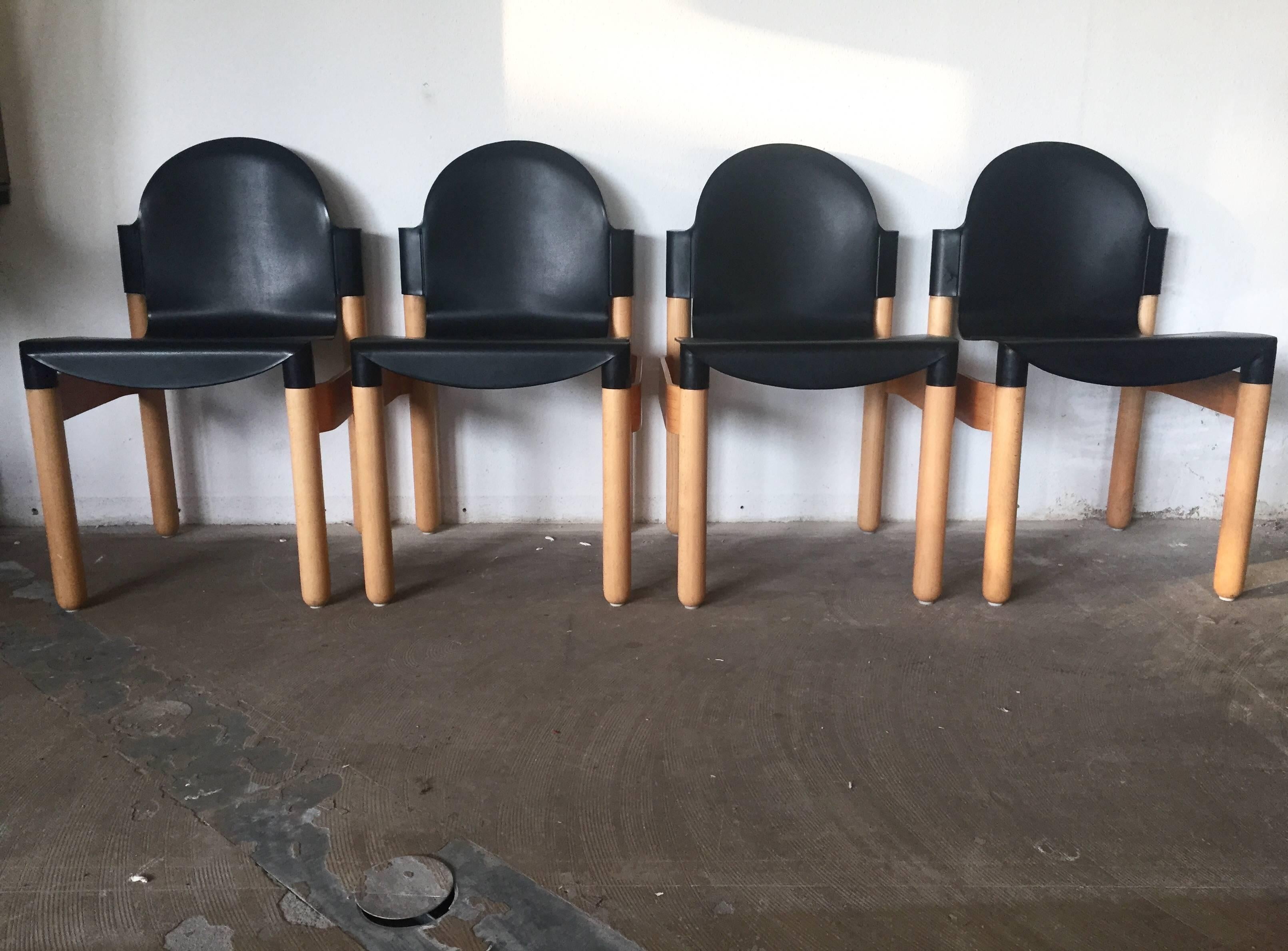 Set of four stacking chairs designed by Gerd Lange in 1983. They were manufactured in The Netherlands. They come with an artificial seating and beech frame. The set is marked with the manufacturer's name and remain in a very good condition with