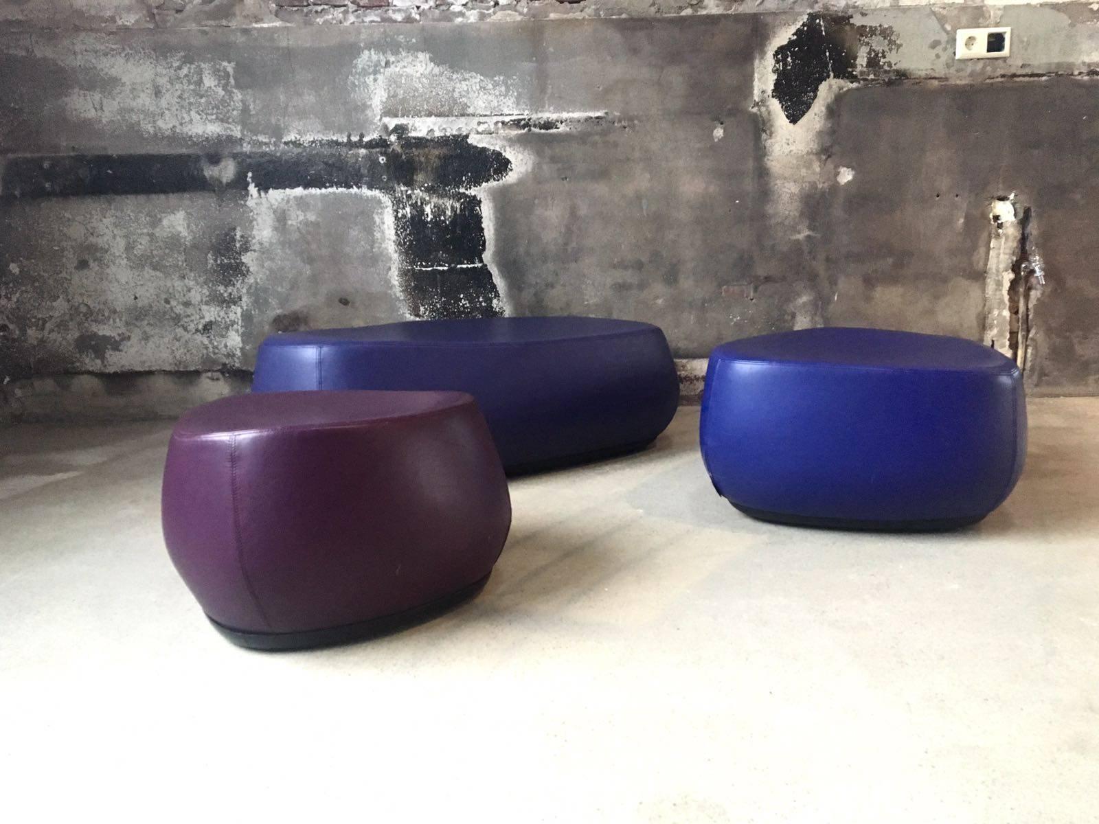 These stones were designed in 2002 by Patricia Urquiola for Moroso Italy. They are part of the Fjord seating collection that is comprised of a large, medium and a smaller stool or stone. This set come in three kinds of purple. They can be used as
