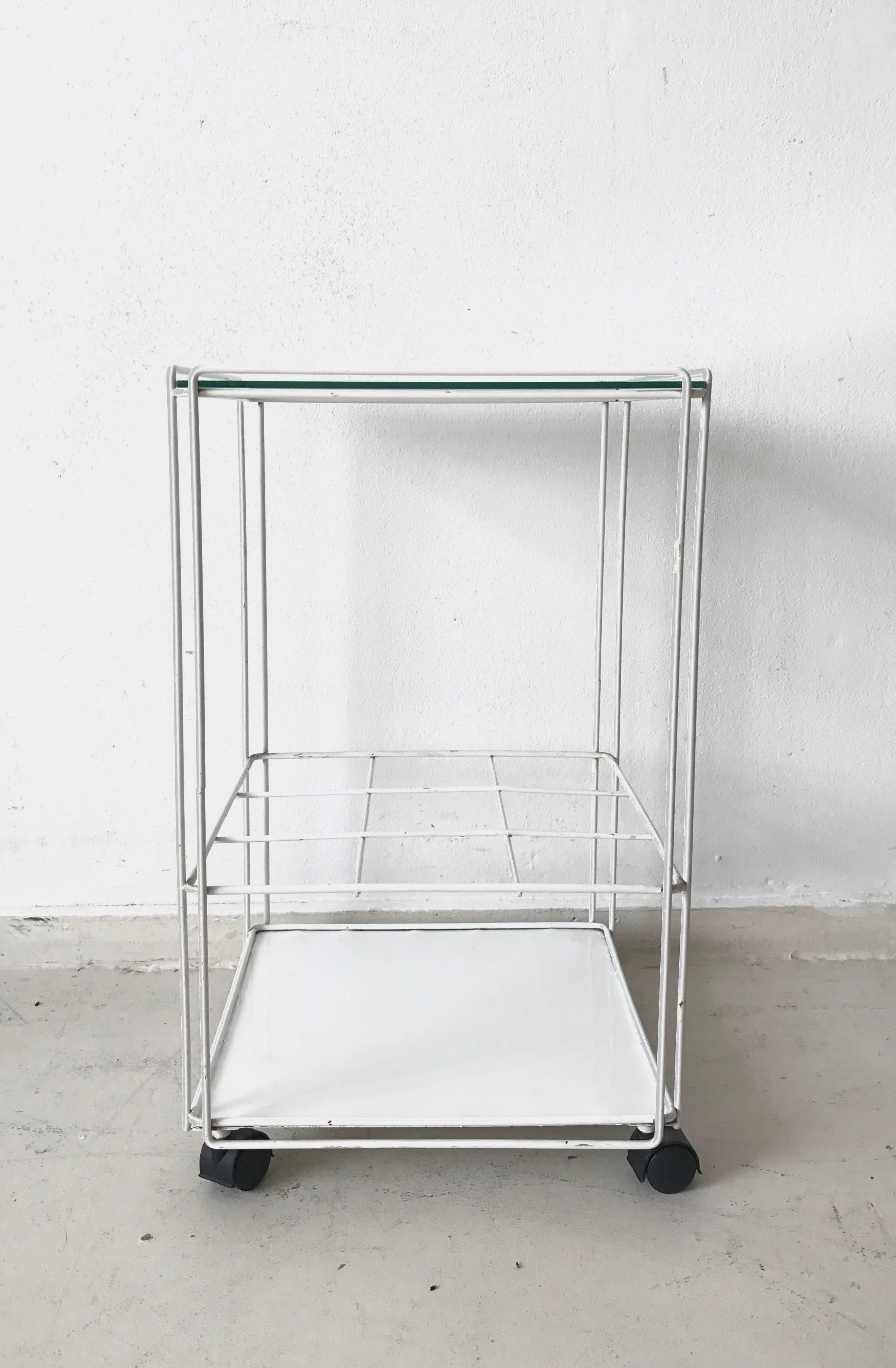 Industrial modern vintage bar cart attributed to the French designer, Max Sauze. It comes in a white enameled metal wire frame with a glass top. Super versatile and minimal. Could double as a side table or office cart. In original condition with