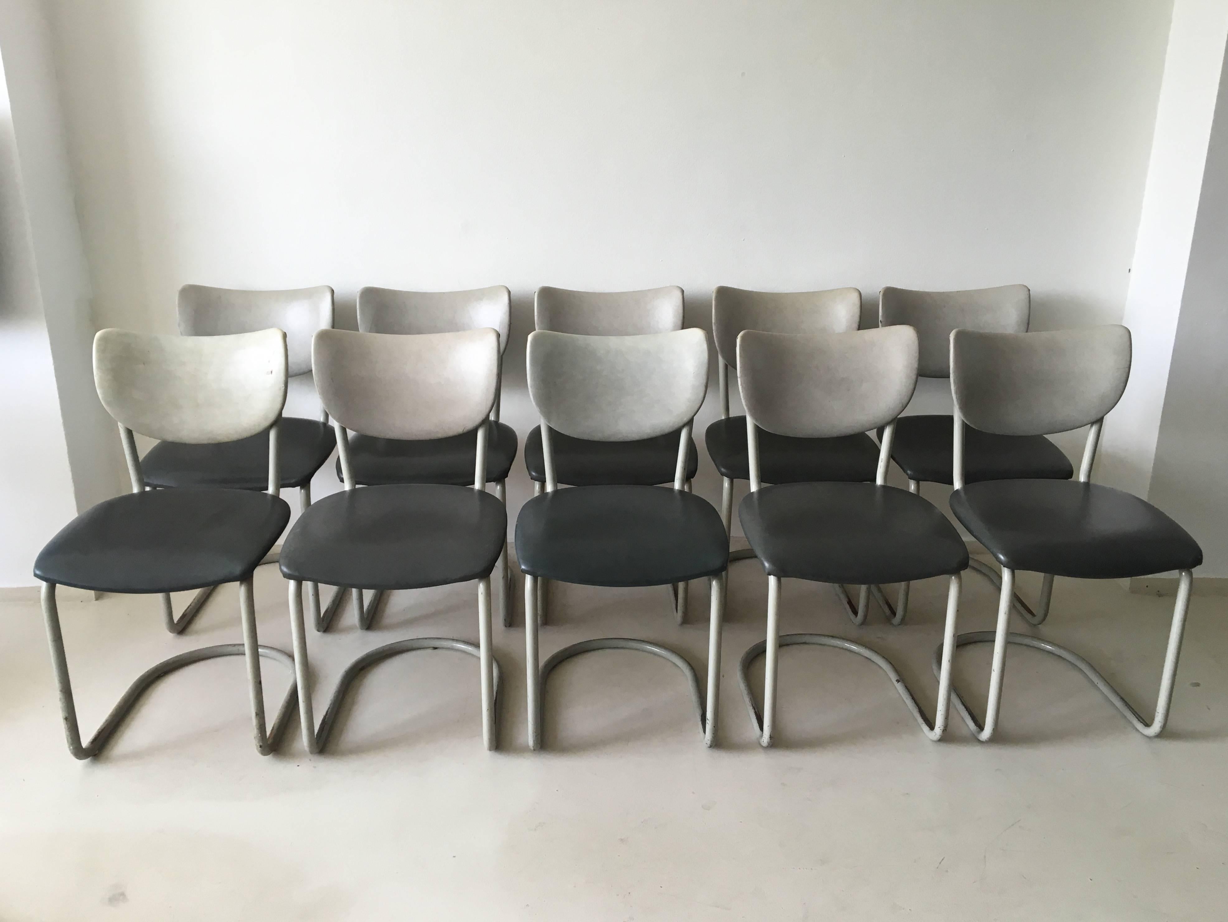These (dining) chairs were designed by De Wit, Schiedam in the 1950s. The chairs consist of a polished and coated metal frame. Upholstery is in grey and anthracite leatherette. They have an Industrial look and remain in a sturdy, good vintage