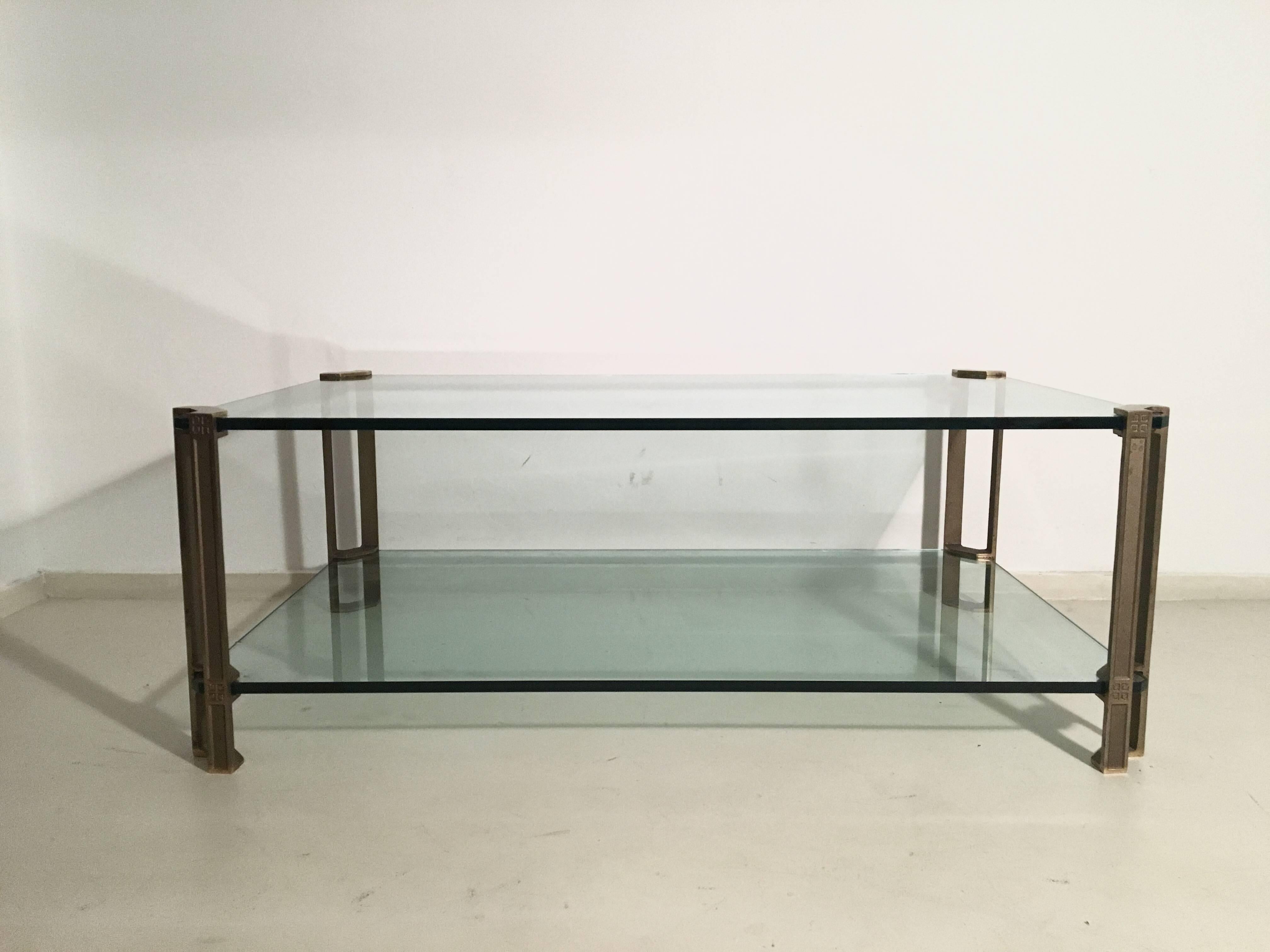 This T24D coffee table was designed by Peter Ghyczy and was manufactured in 1979 in the Netherlands. This table comes with two thick glass tops and features brass legs. Other then the minor chip in the glass, the table remains in excellent condition.