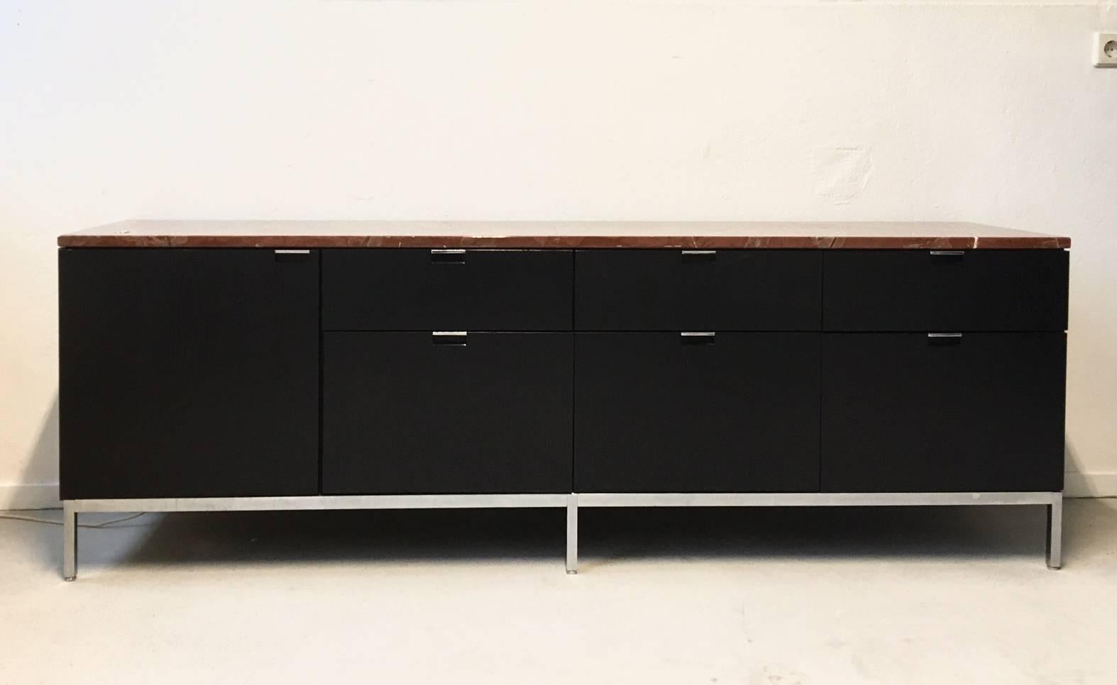 When Florence Knoll transformed the traditional private office configuration by replacing the executive desk with a table, she needed to provide an alternative to the lost storage space. Her solution was the Credenza. The low cabinet's iconic design