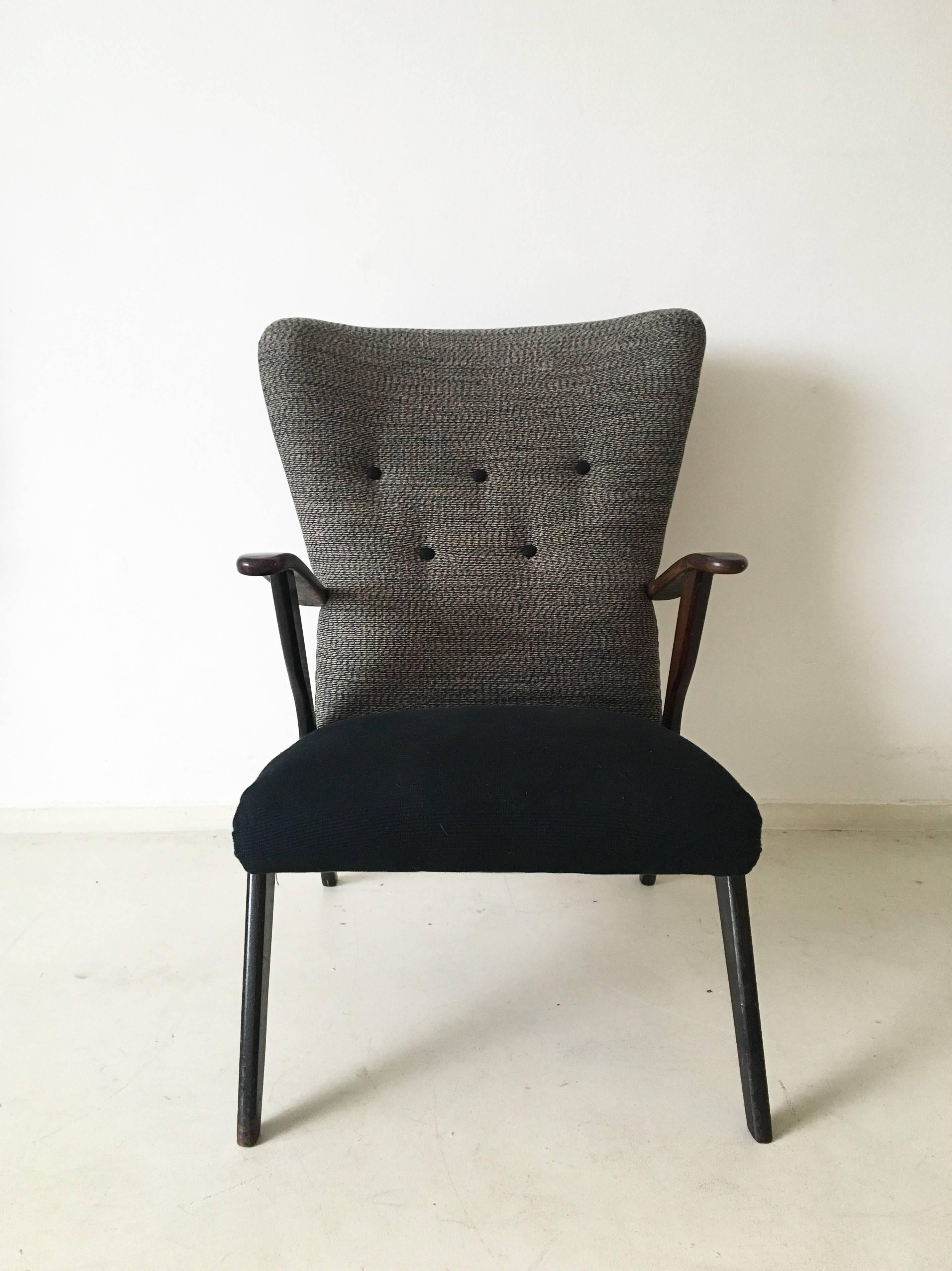 Wonderful re-upholstered wingback chair in style of Ercol. This easy or lounge chair belongs to the three-seat sofa we also have in stock. It is in good condition with some signs of age and use (very small scratches and cracks to it's frame).