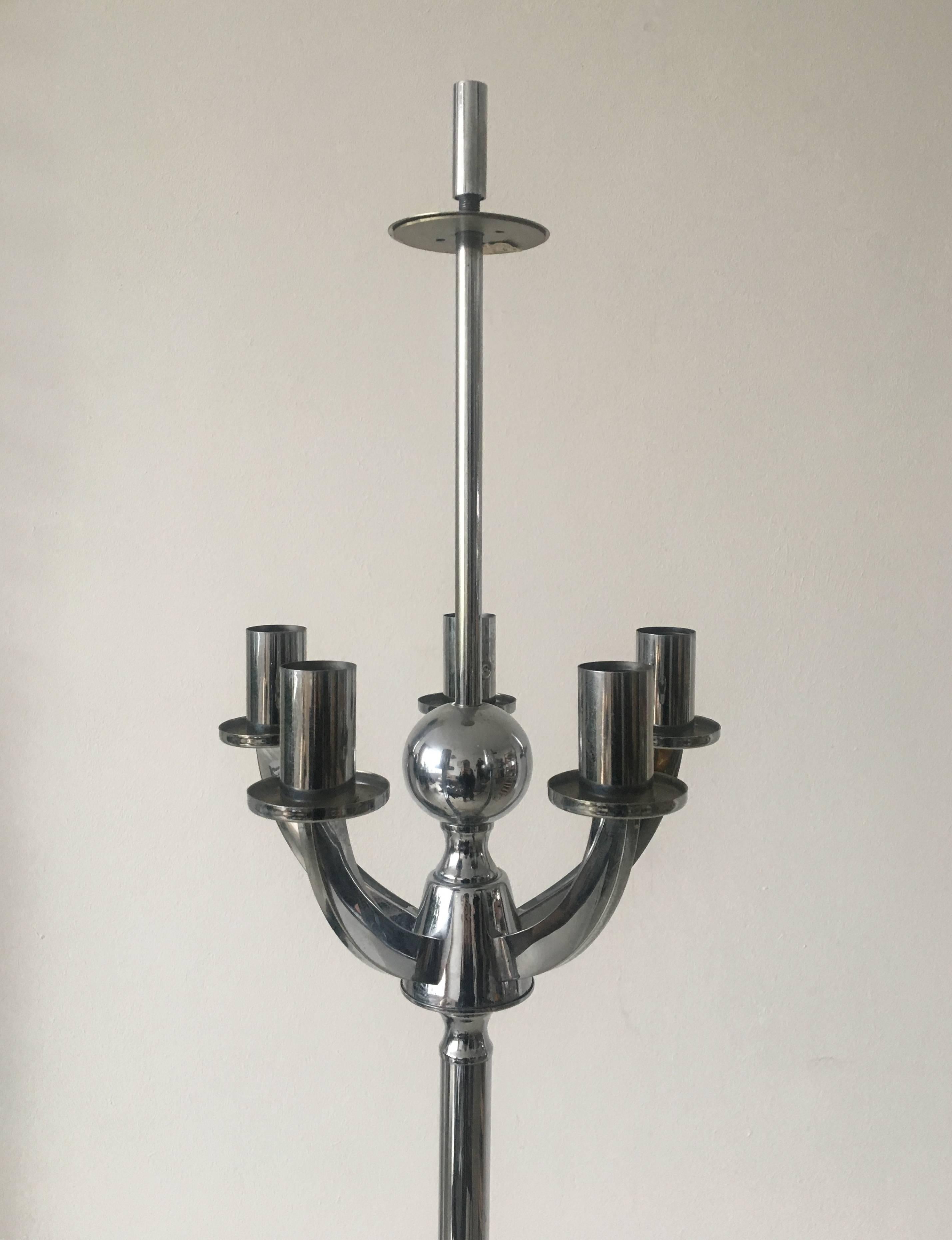 This wonderful lamp features a metal Chromed foot with five arms and an umbrella style shade in fabric. However it's designer and manufacturer remains unknown it's most likely produced by Staff Leuchten but gives you the idea of a Italian design as