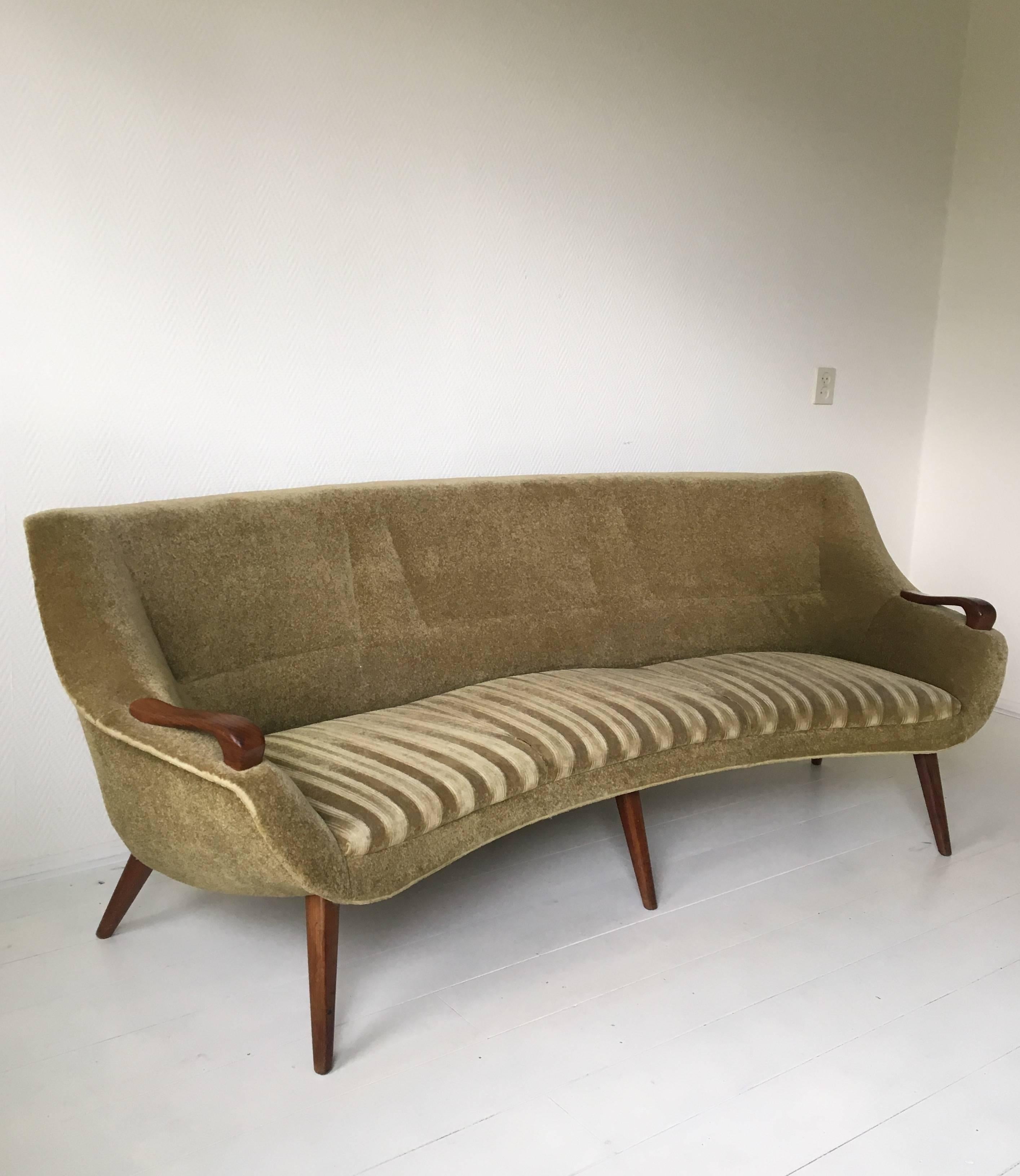 Super elegant sofa set, designed and manufactured in Europe. The set features green Velours fabric and wonderful teak handles and feet. The sofa is slightly curved. However this set is in sturdy condition, the pieces should best be reupholstered