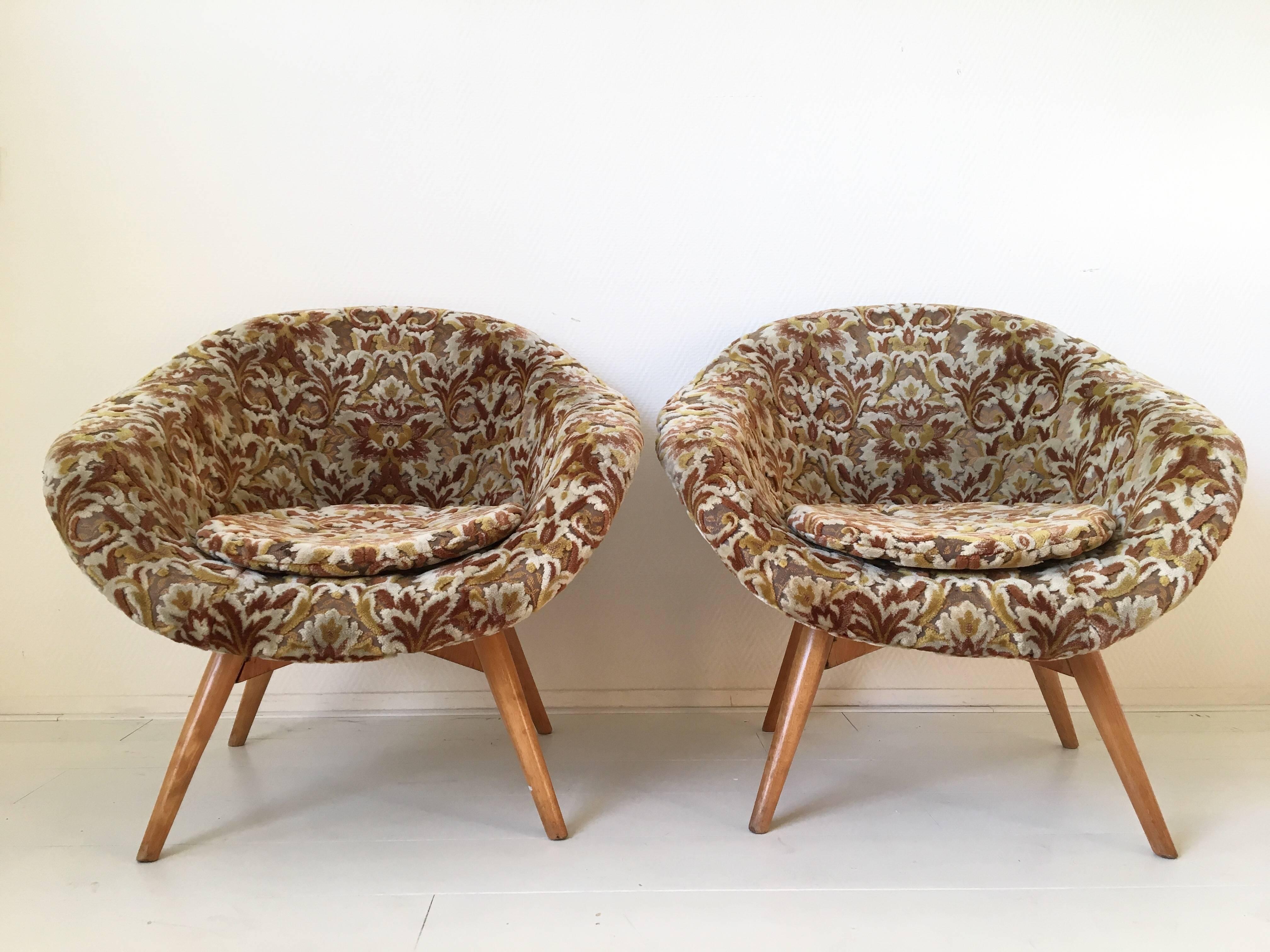 Two extravagant chairs, designed by Miroslav Navrátil for Vertex, circa 1950s. The chairs feature a beech structure with a Baroque style fabric. Both chairs are sturdy and still have the original cushions. Good condition with some wear and color