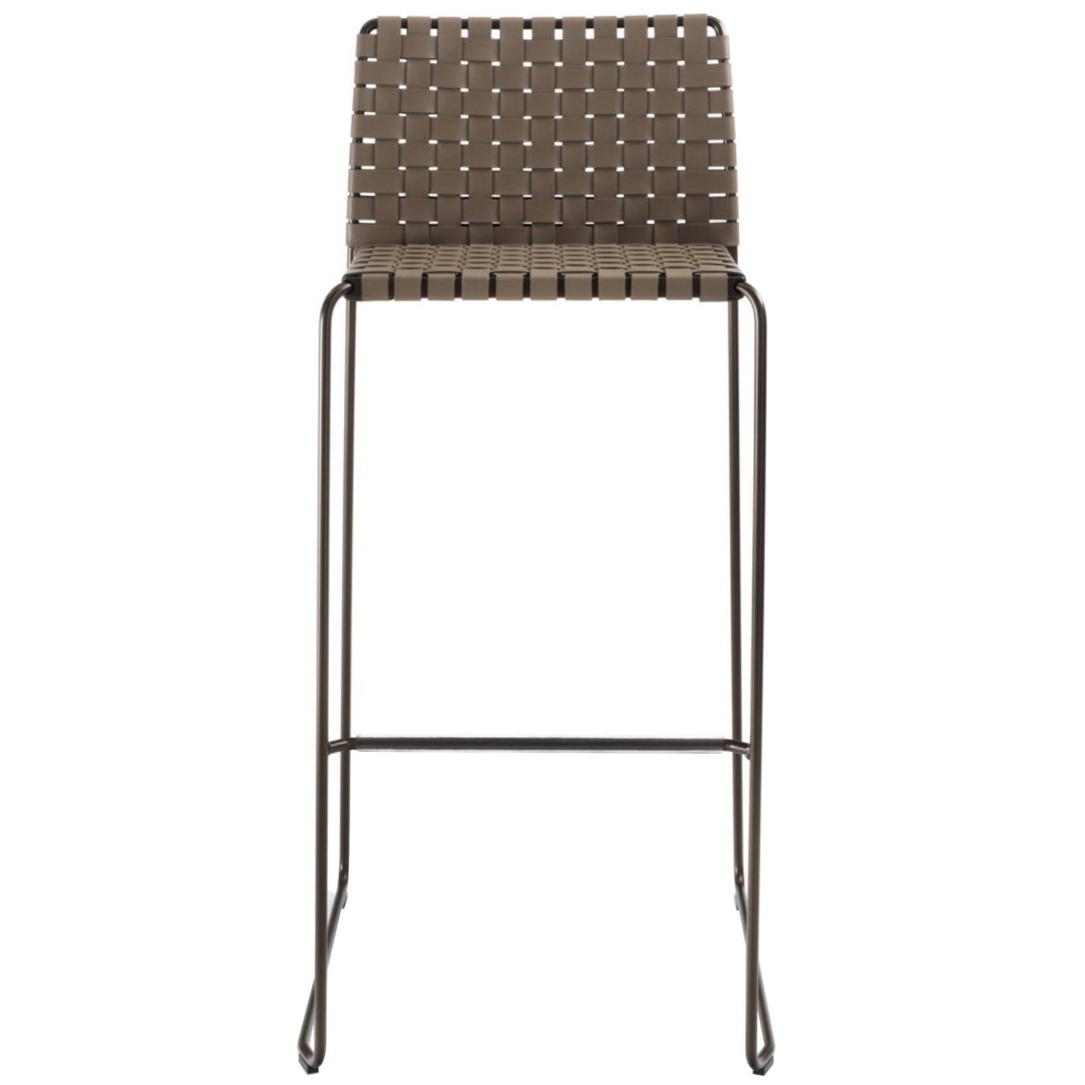 Italian woven leather modern counter or bar stool. Chrome or painted steel frame finished aluminum, matte white, bronze, matte black or raw natural, in round section, with seat and back covered with woven leather. Metal seat pan. High quality