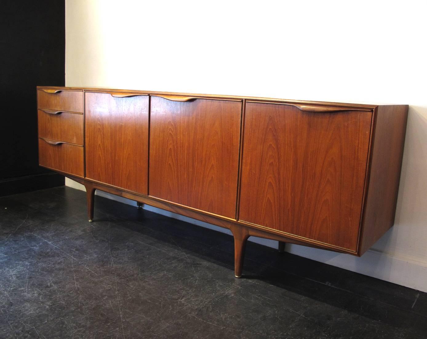1960s teak sideboard and dry bar was manufactured in Scotland by A. H. McIntosh, the first company to bring Scandinavian Modern to the United Kingdom.