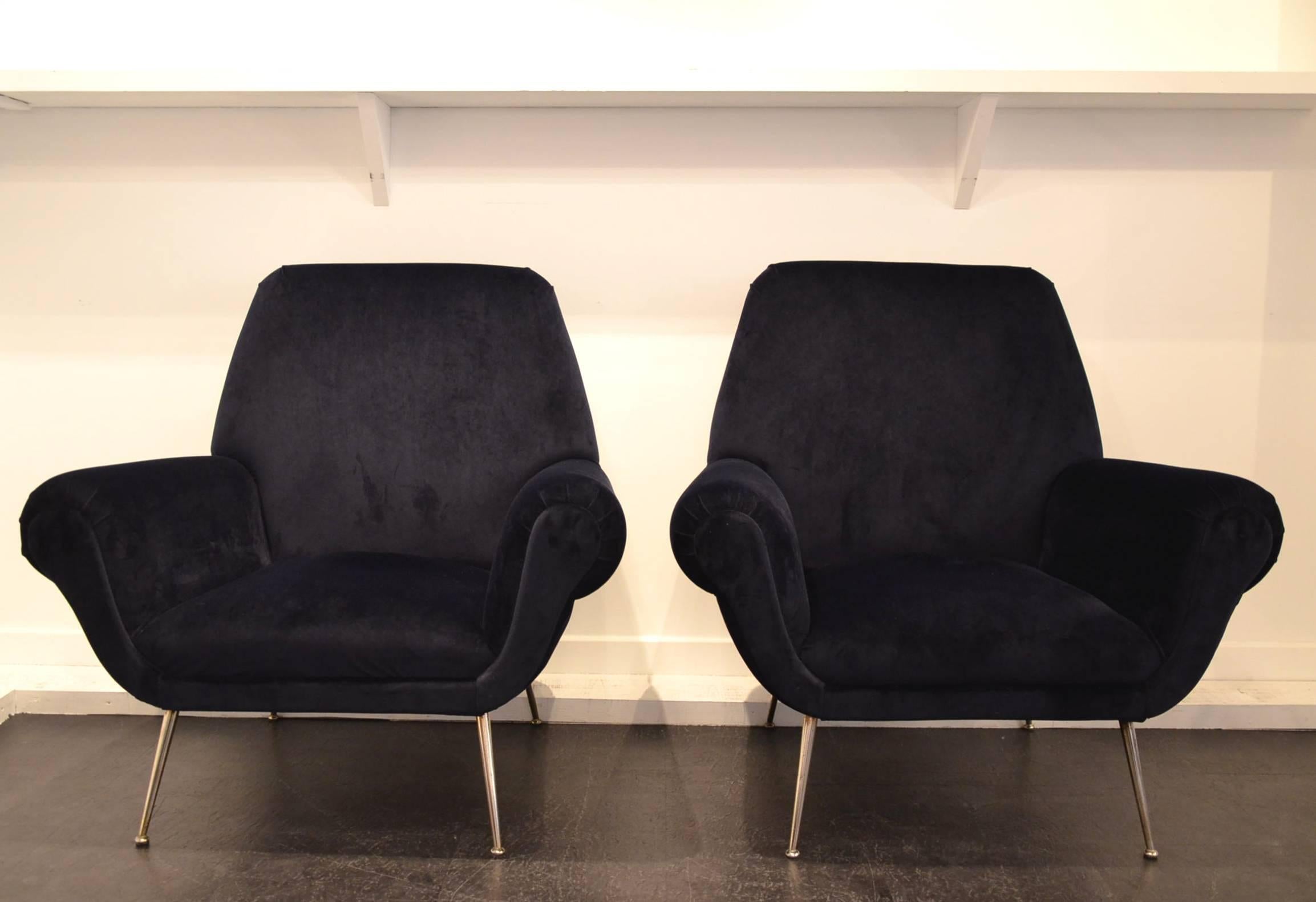 Gigi Radice Mid-Century club chairs reupholstered in a night blue velvet fabric.