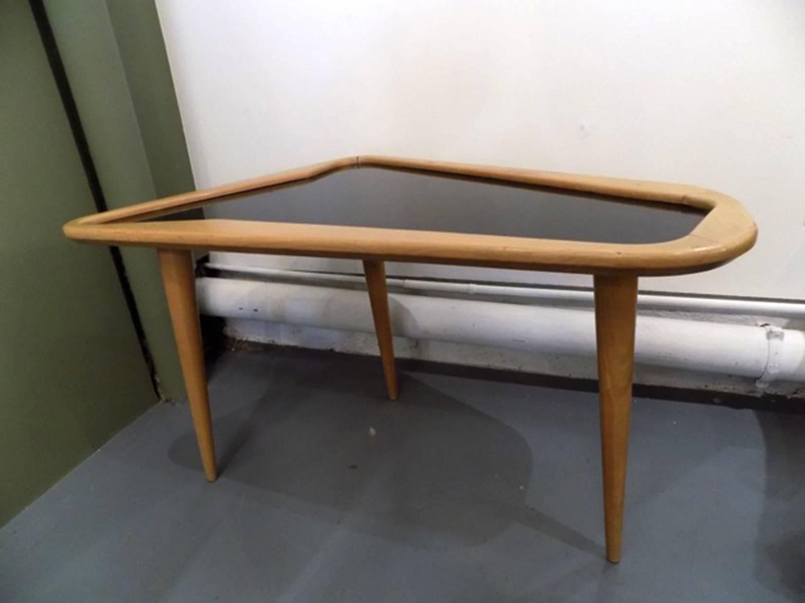 Charles Ramos free-form coffee table, circa 1950.
Those free-form coffee table was designed in France in 1956 by Charles Ramos. It is made from oak and features a laminated top. 
It is in excellent vintage condition.

Available single as