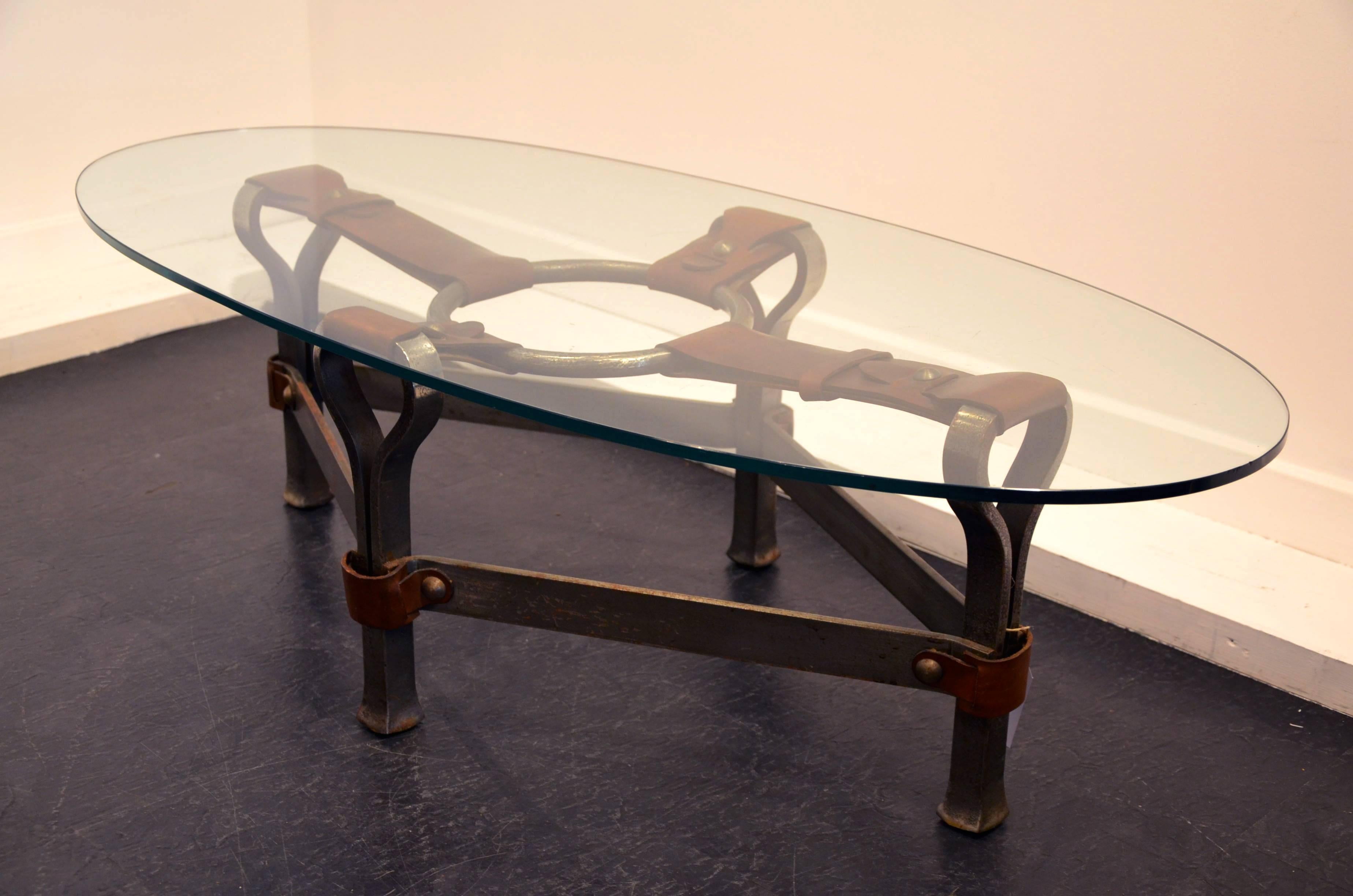 Beautiful ellipse steel and leather cocktail table.