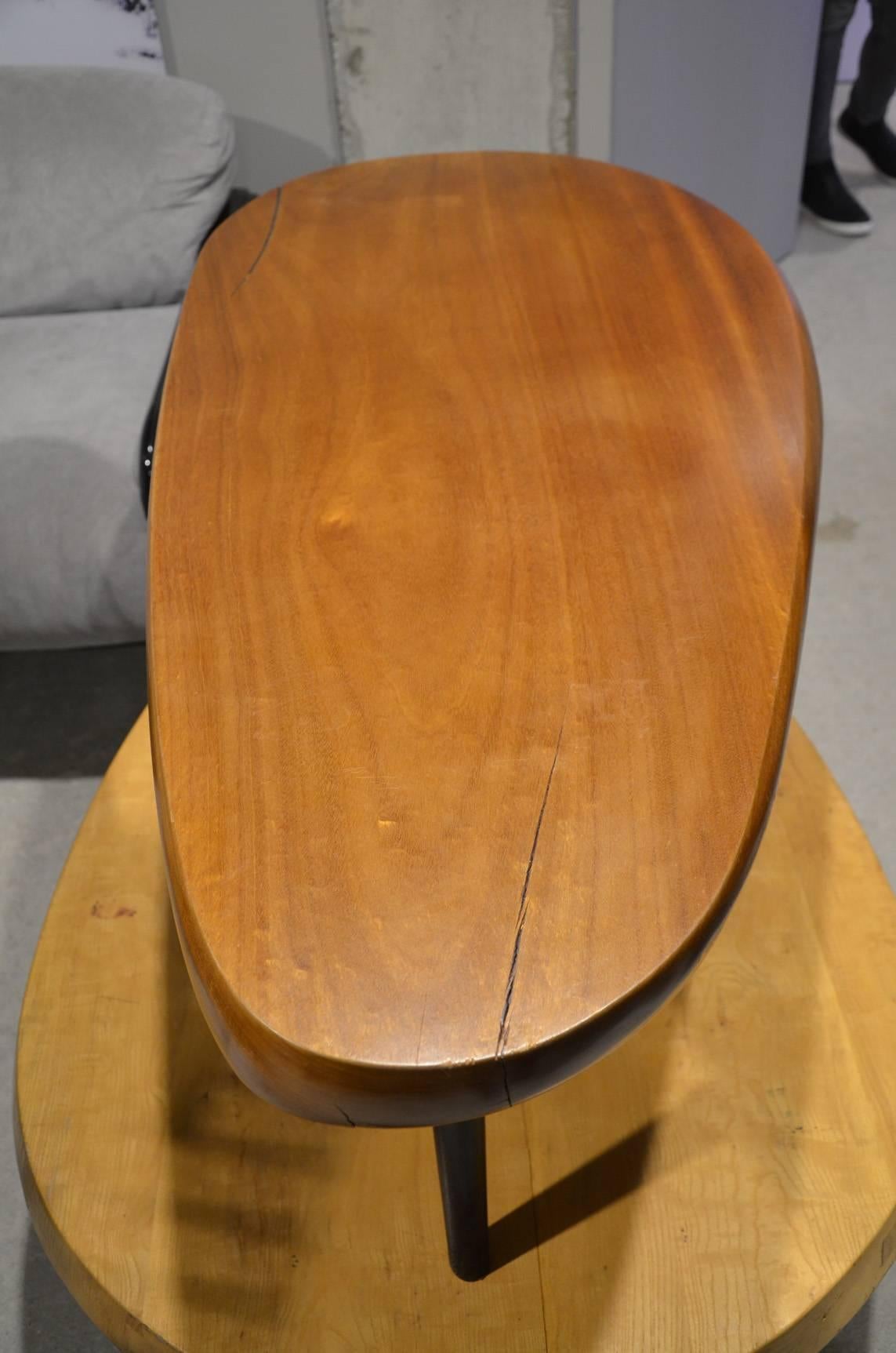 Beautiful mahogany cocktail table In the style of Charlotte Perriand.