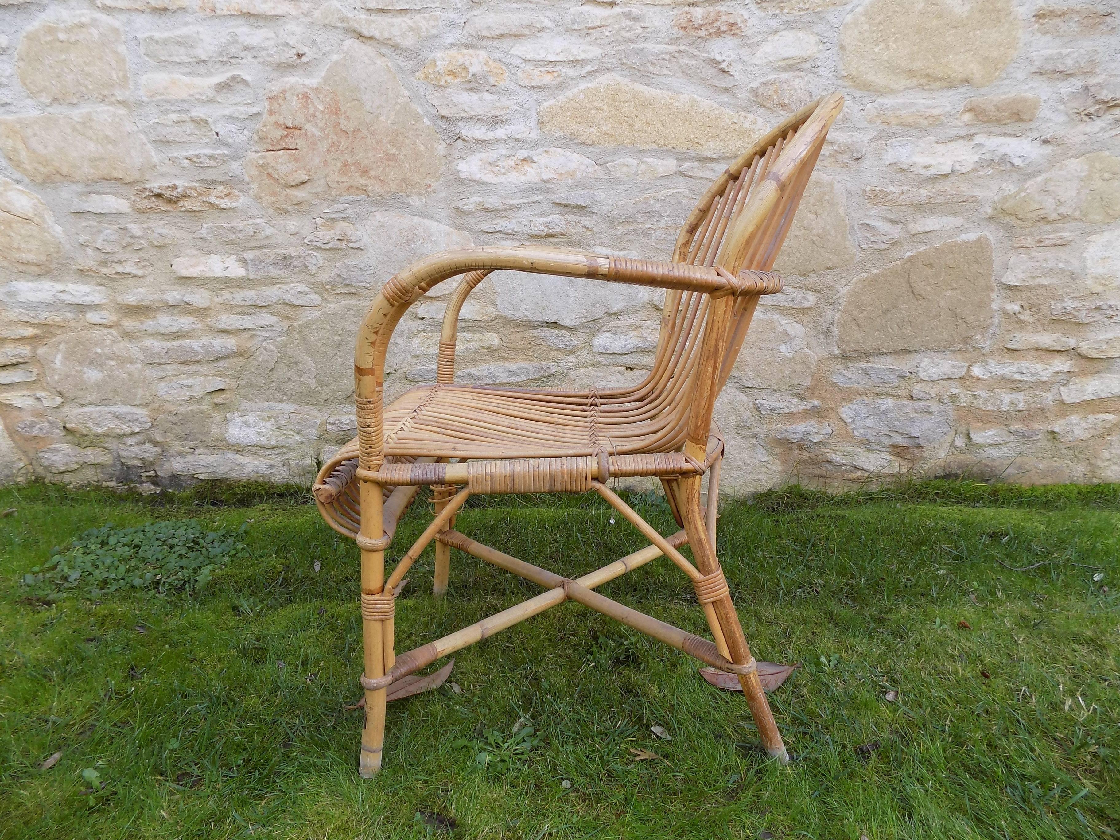 Beautiful pair of wicker armchair by Audoux Minet, circa 1960. Excellent condition.