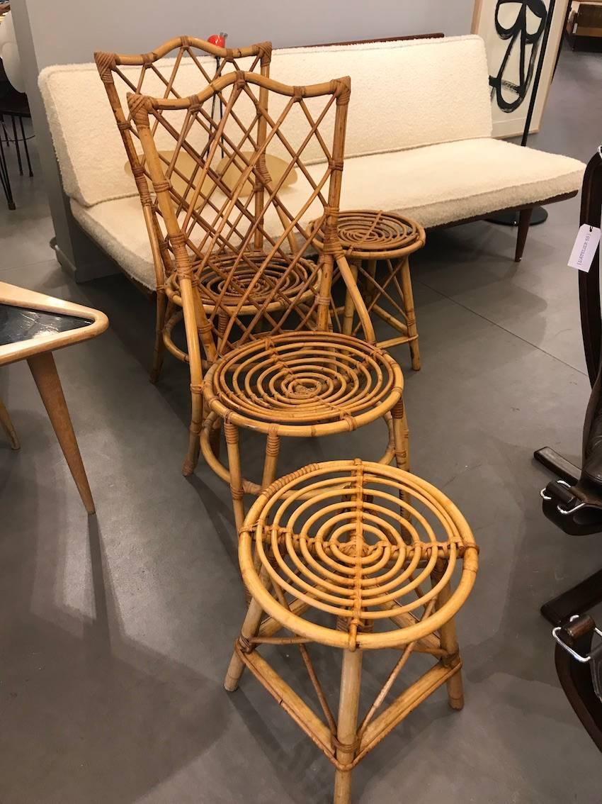 Fantastic set of four Audoux Minet Wicker chairs, circa 1960. Excellent condition.