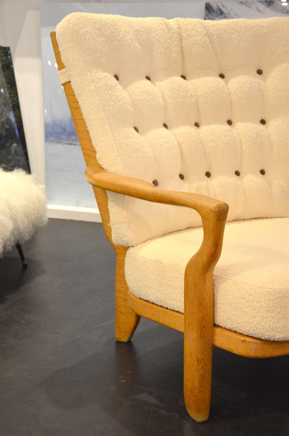 Pair of armchairs reupholstered in white wool fabric.