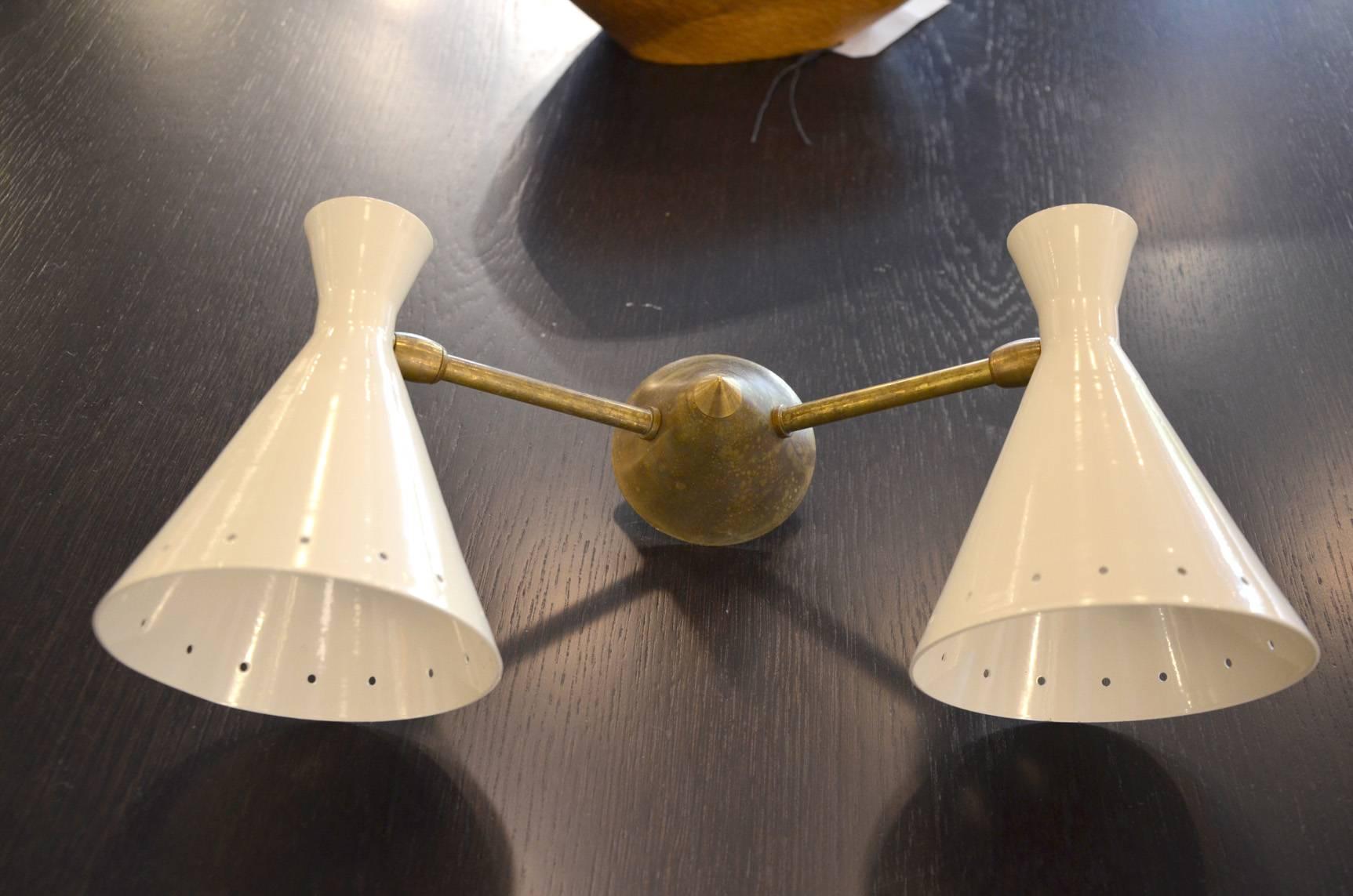 Beautiful set of four Italian brass sconce in the taste of Stilnovo. In excellent condition.
