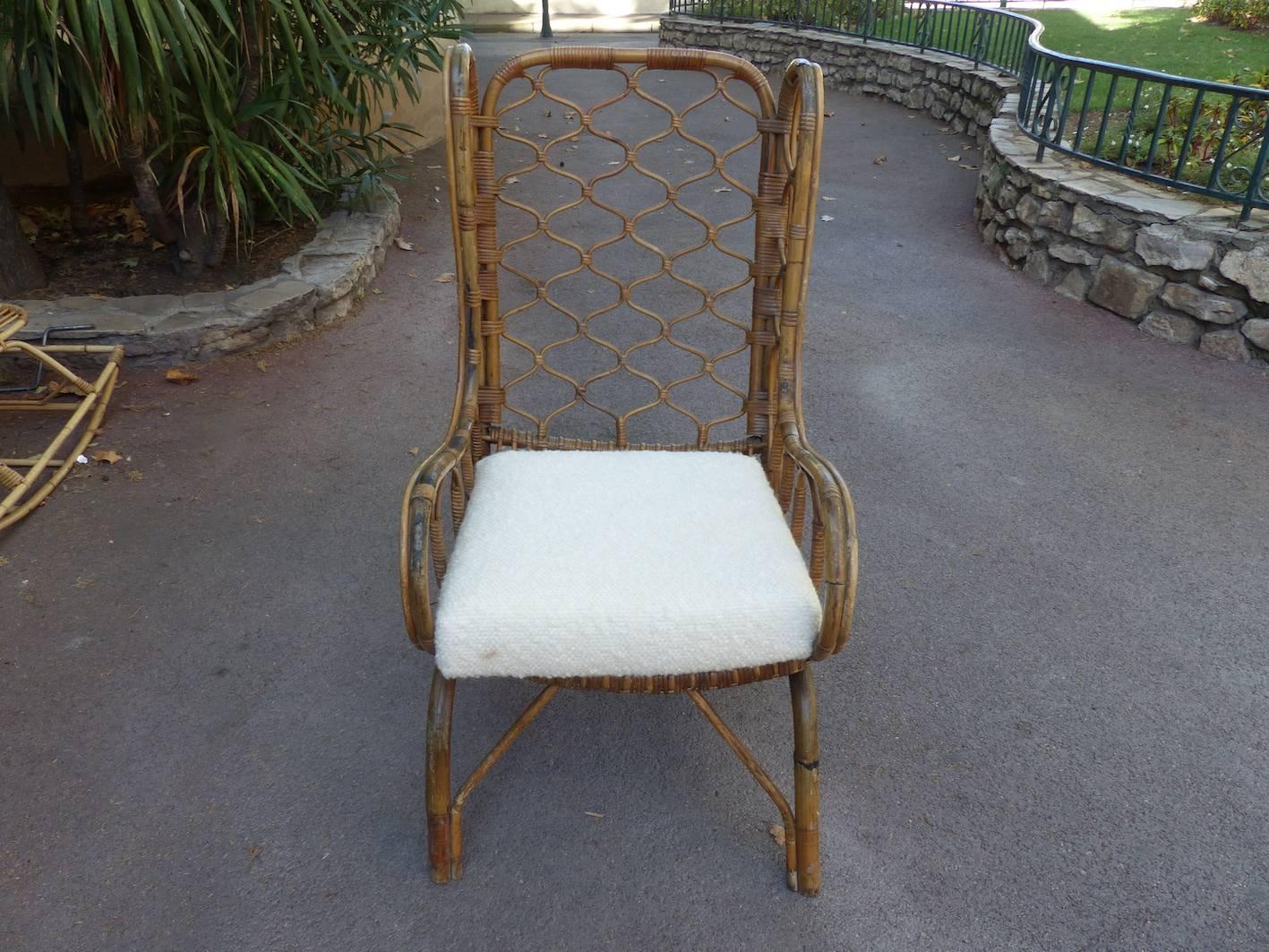 Beautiful wicker armchair circa 1960, seat reupholstered, in excellent condition.