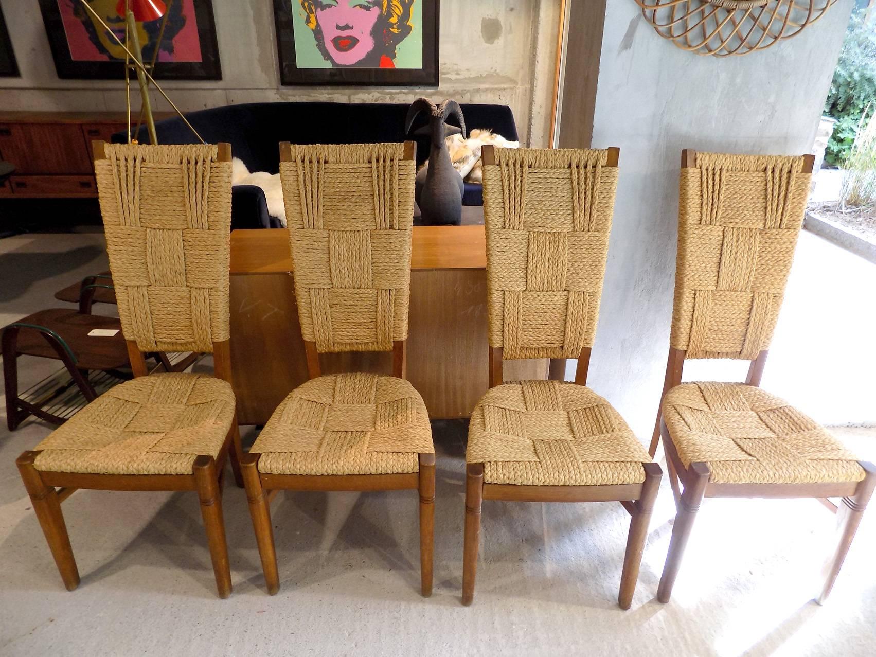 Beautiful set of four French rope and wood chairs, circa 1960. Excellent condition.