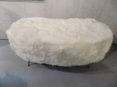 Large bench with fur and brass feet