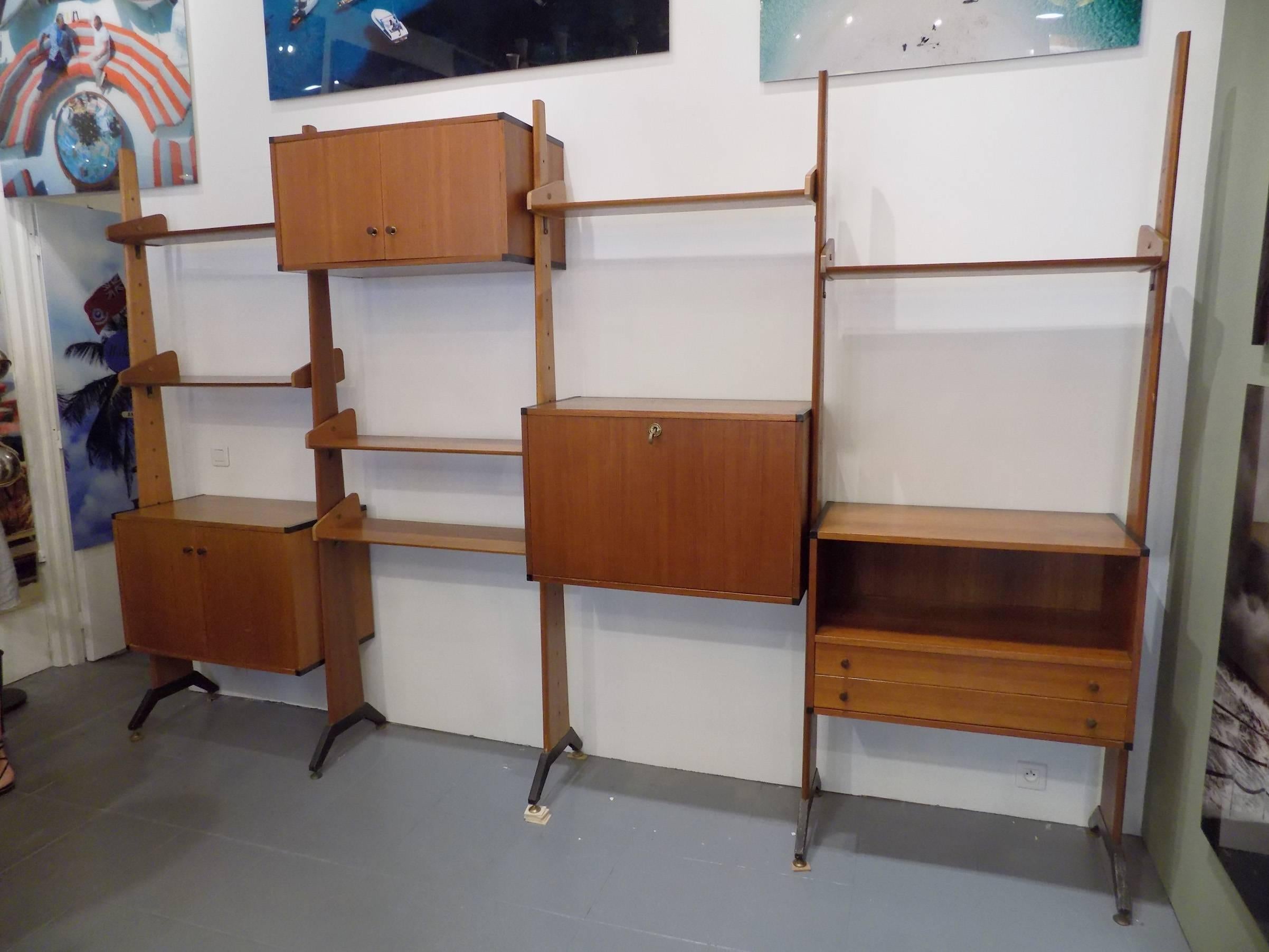 Franco Albini style rosewood and brass bookcase Italy, circa 1958.
Each shelf and arrangement are adjustable.