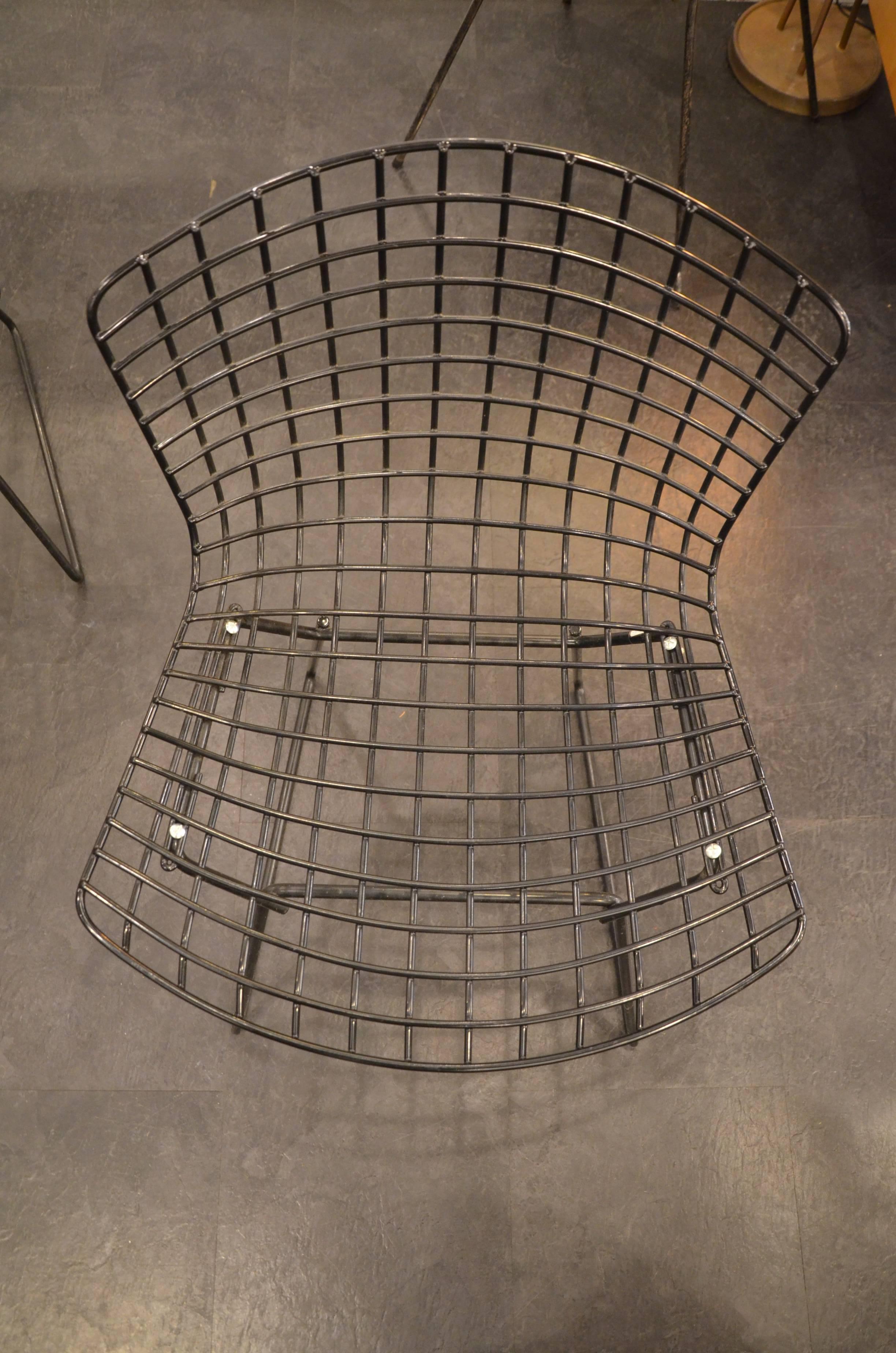 Two Harry Bertoia for Knoll black wire dining chairs in excellent condition.