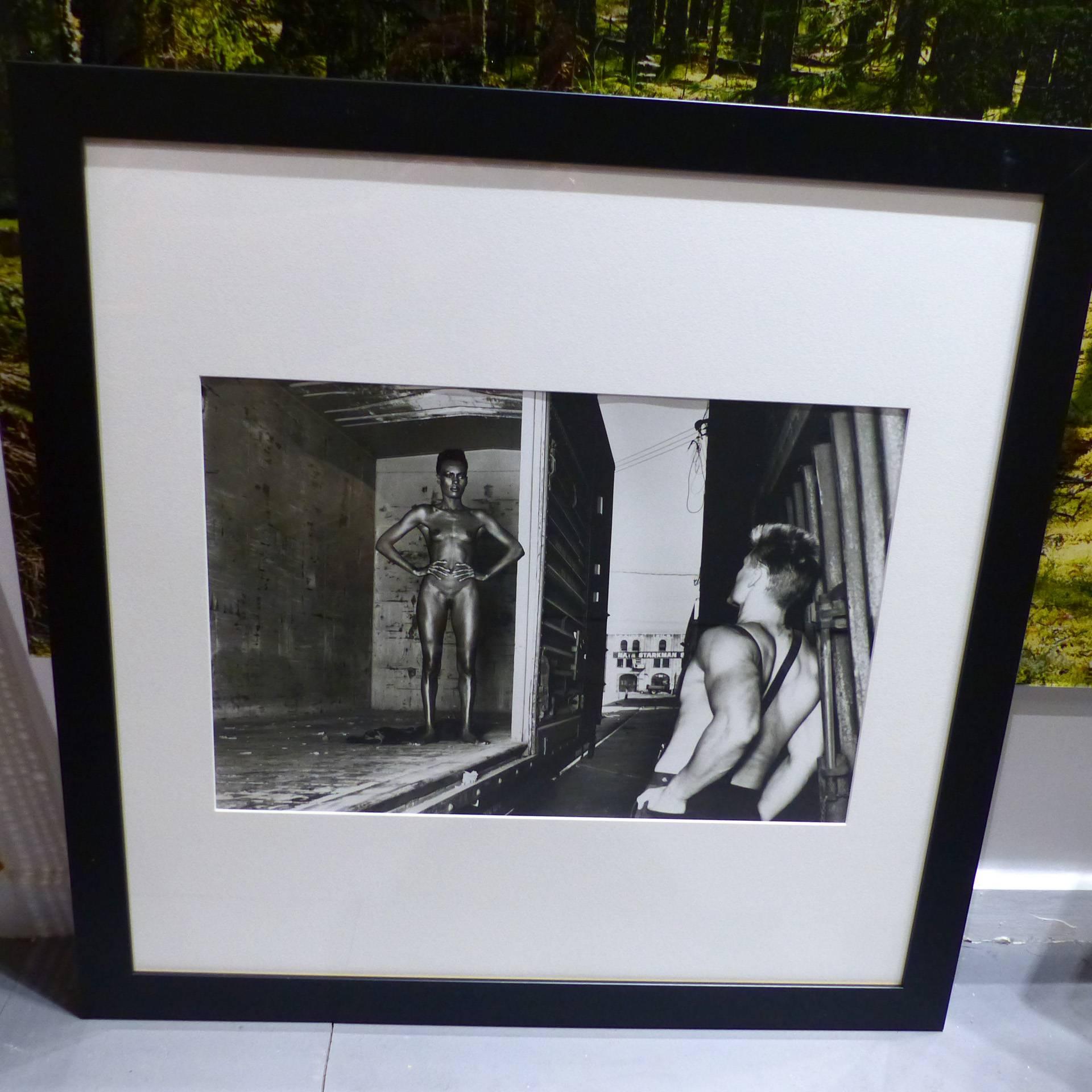 Helmut Newton framed poster, Grace Jones and Dolph Lundgren, Los Angeles 1985.