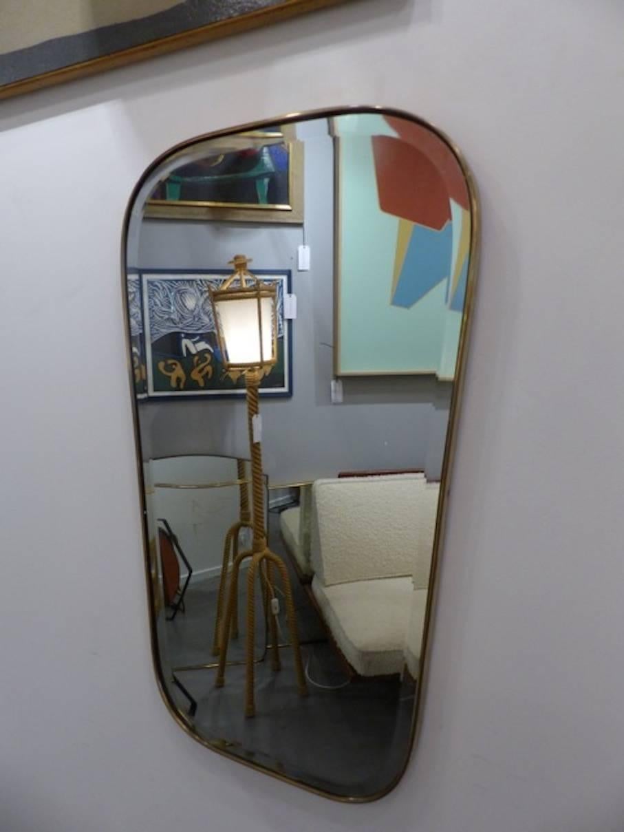 Beautiful Italian brass mirror circa 1960, bevelled glass.
Measures: W top 48cm, bottom 38cm
A small mercury loss.