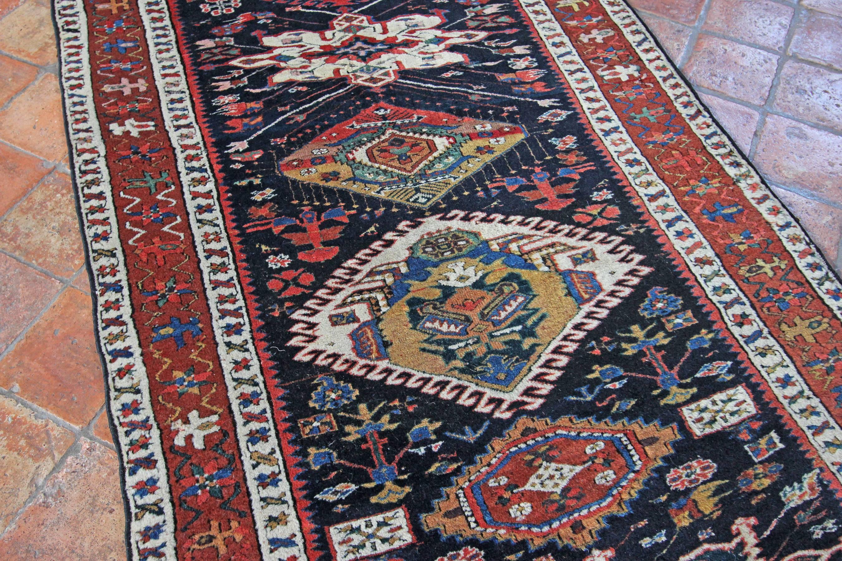 Wonderful royal blue background on this excellent condition antique Karaja runner, Persia. Warm colours and bold medallions would enhance any corridor or entrance area. In excellent condition all-over with a high wool pile a great durable antique