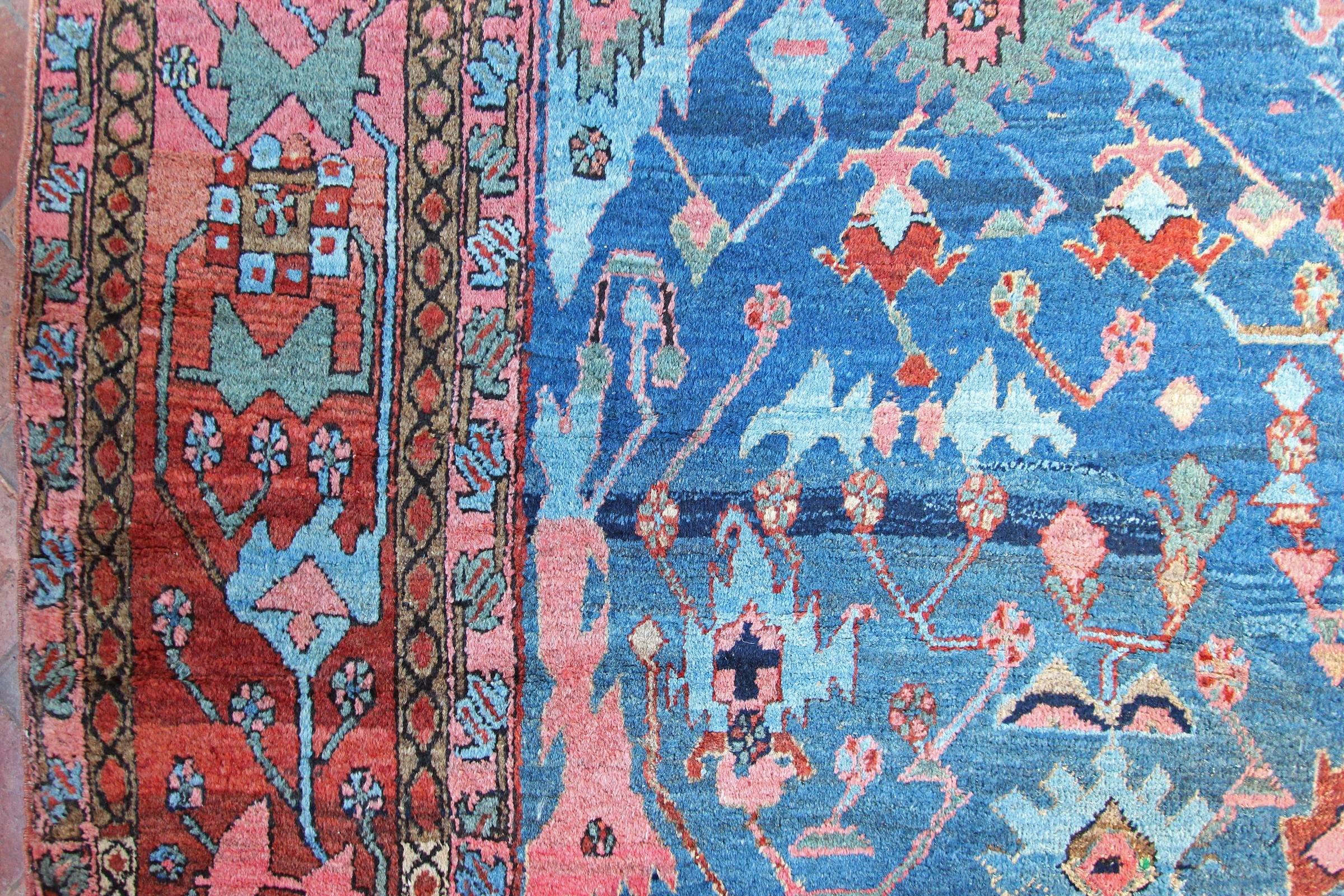 An antique Bakshaish carpet with exquisite colors and design.  More often Bakshaish carpets were woven in larger sizes and often with bold geometric designs and vivid colors. Their designs can be quite abstract and nearly always comprised of a