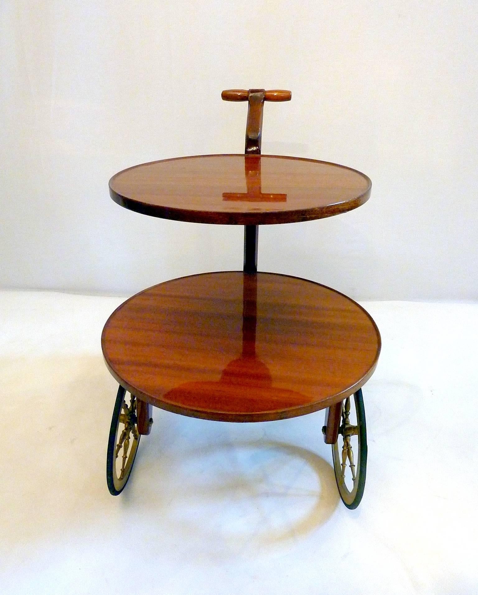 Unusual bar cart  in teak in the manner of Gio Ponti with two tiers and with a Z-shaped leg. The wheels functions well.
