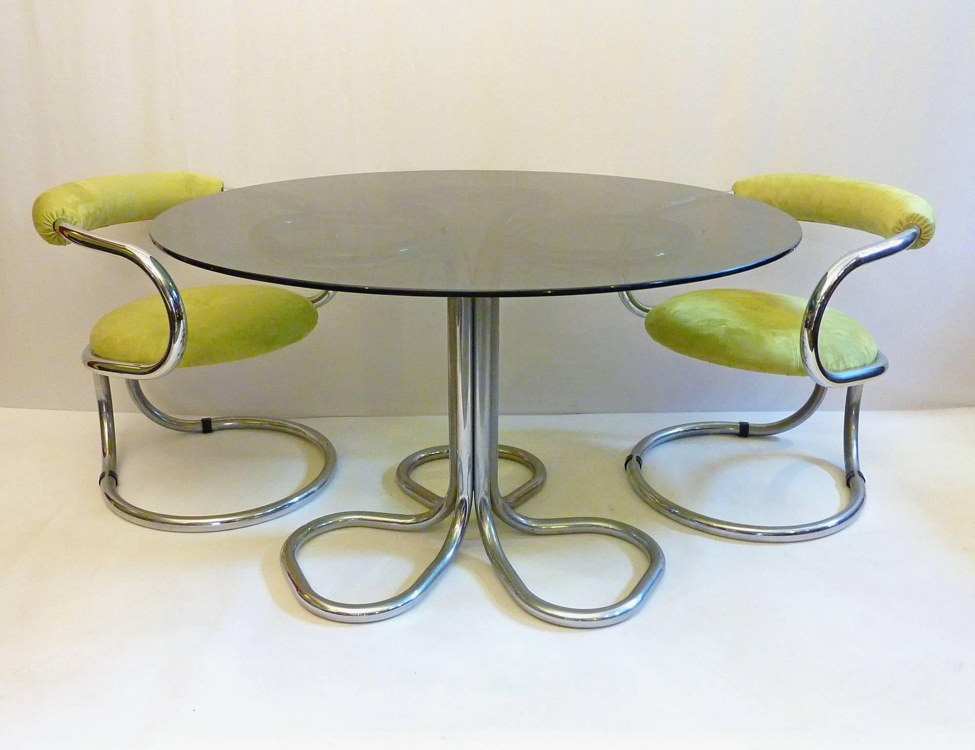 Cool dining room set with a round table with a smoke colored glass top and four chairs. Recently professionally reupholstered chairs in lime green faux suede in the original manner. 
Size: Chair H.72 / L.60 / W.60 / Seat height. 48
Size: Table