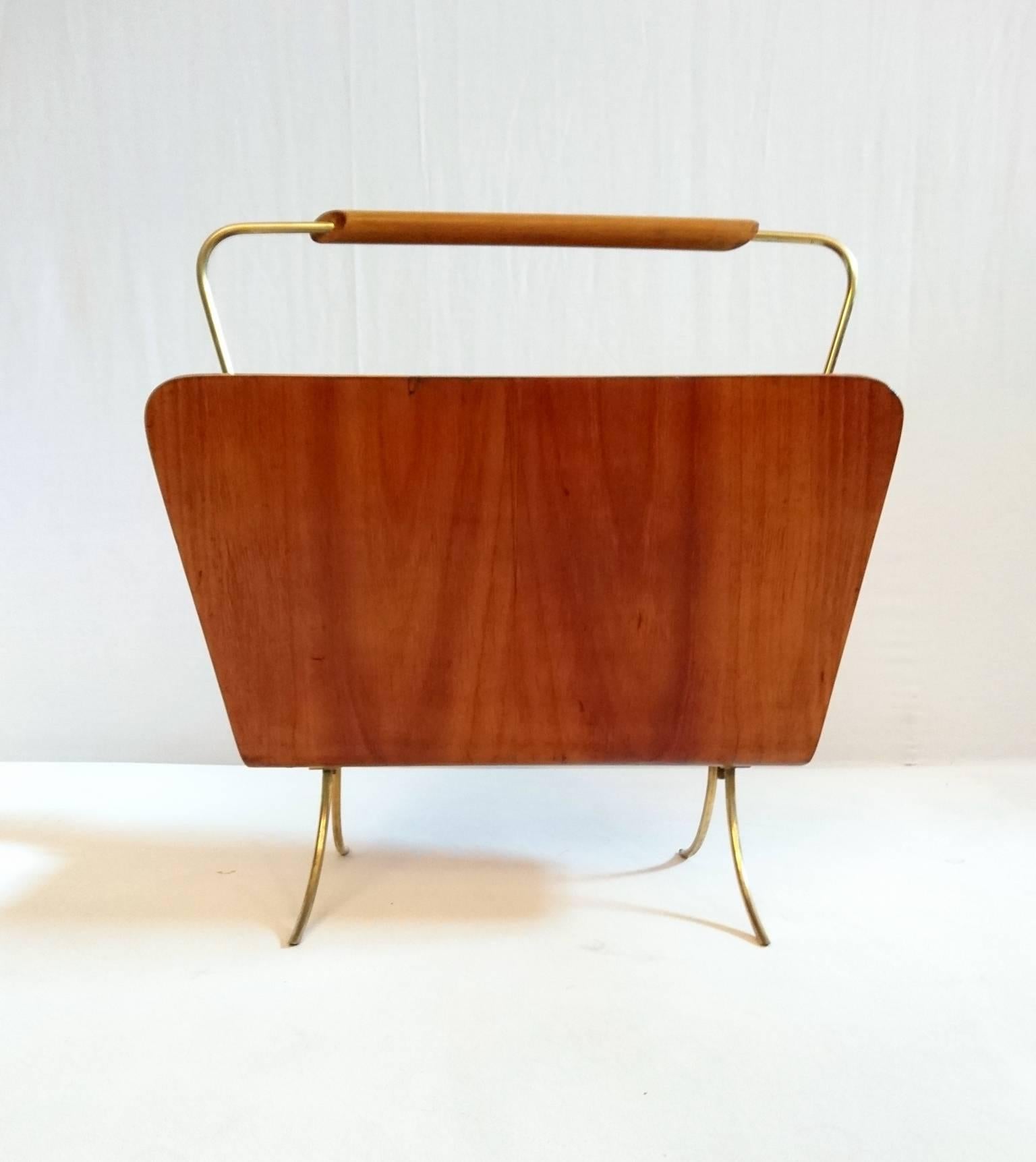 1950s Italian magazine rack in bent ash plywood and details in brass.
